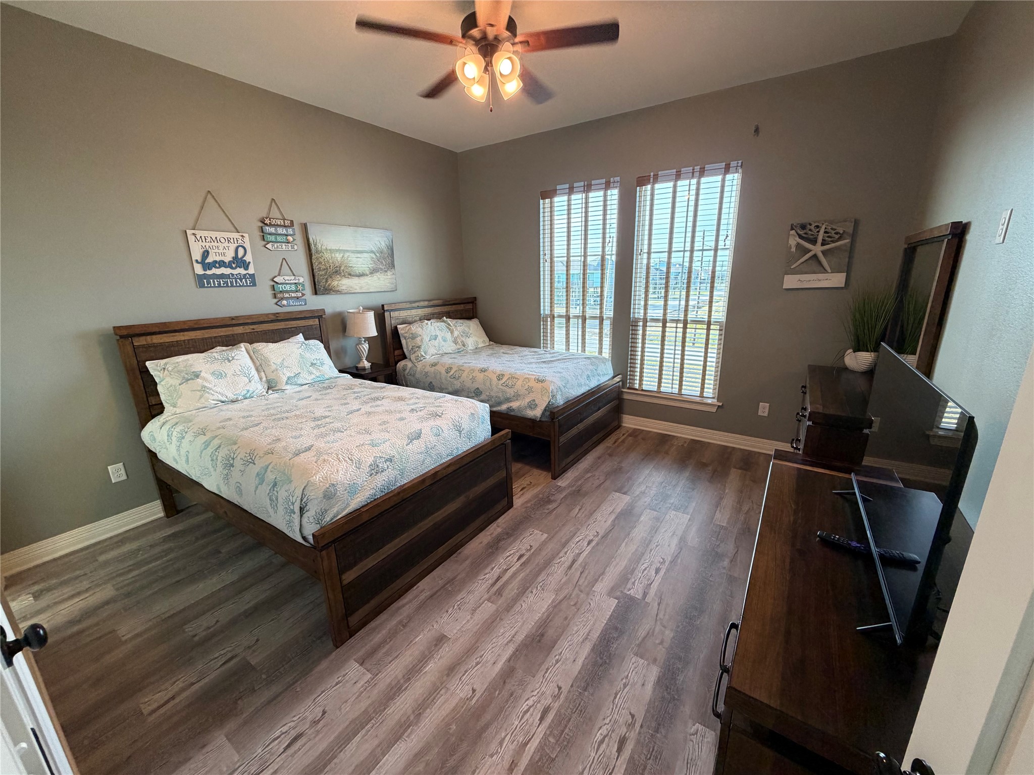 Guest bedroom located north west corner of home with two full-size beds