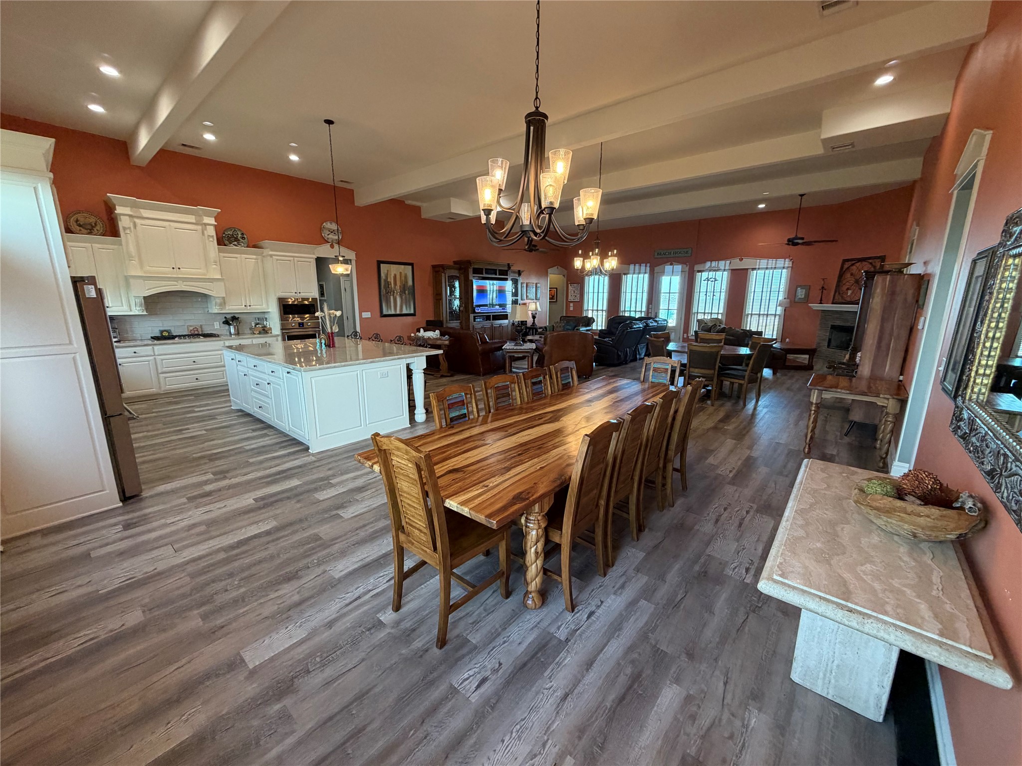 View from corner of dining room room back towards kitchen and living area