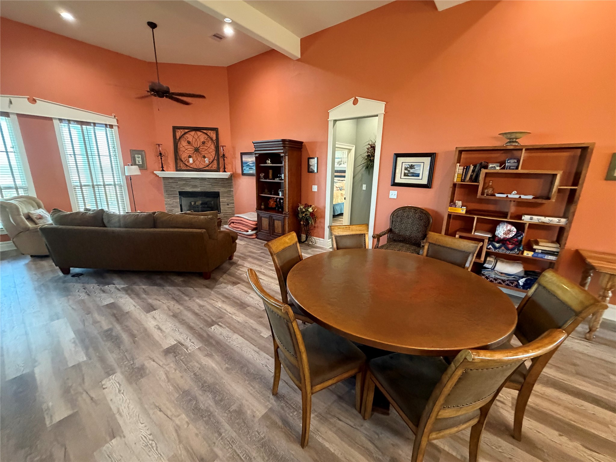 View of additional dining table and seating area with fireplace