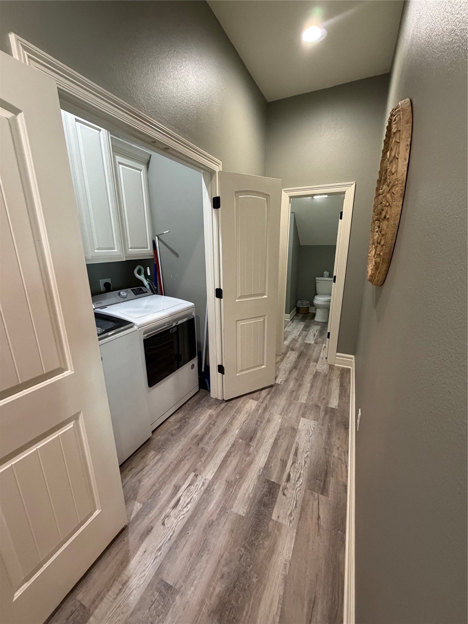 Laundry closet into the right a half bath