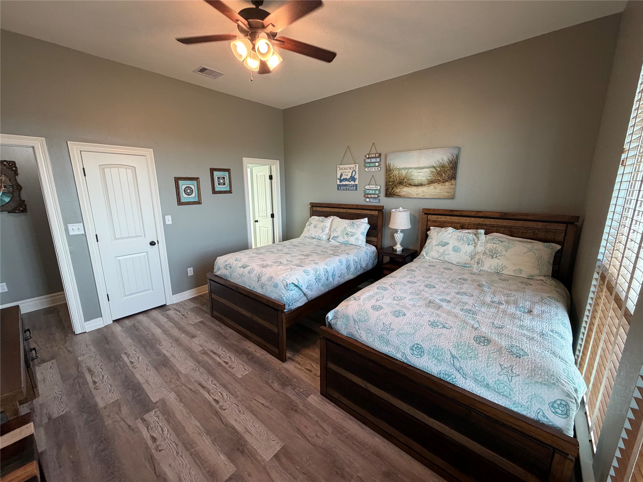 Guest bedroom located north west corner of home with two full-size beds