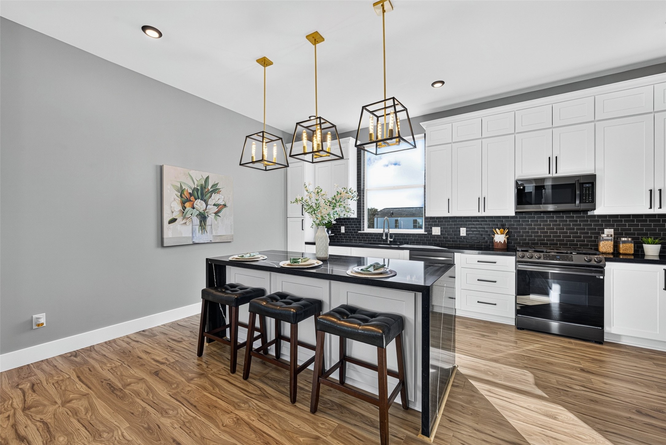 This modern chef's kitchen serves as a warm and central gathering place for the whole family.