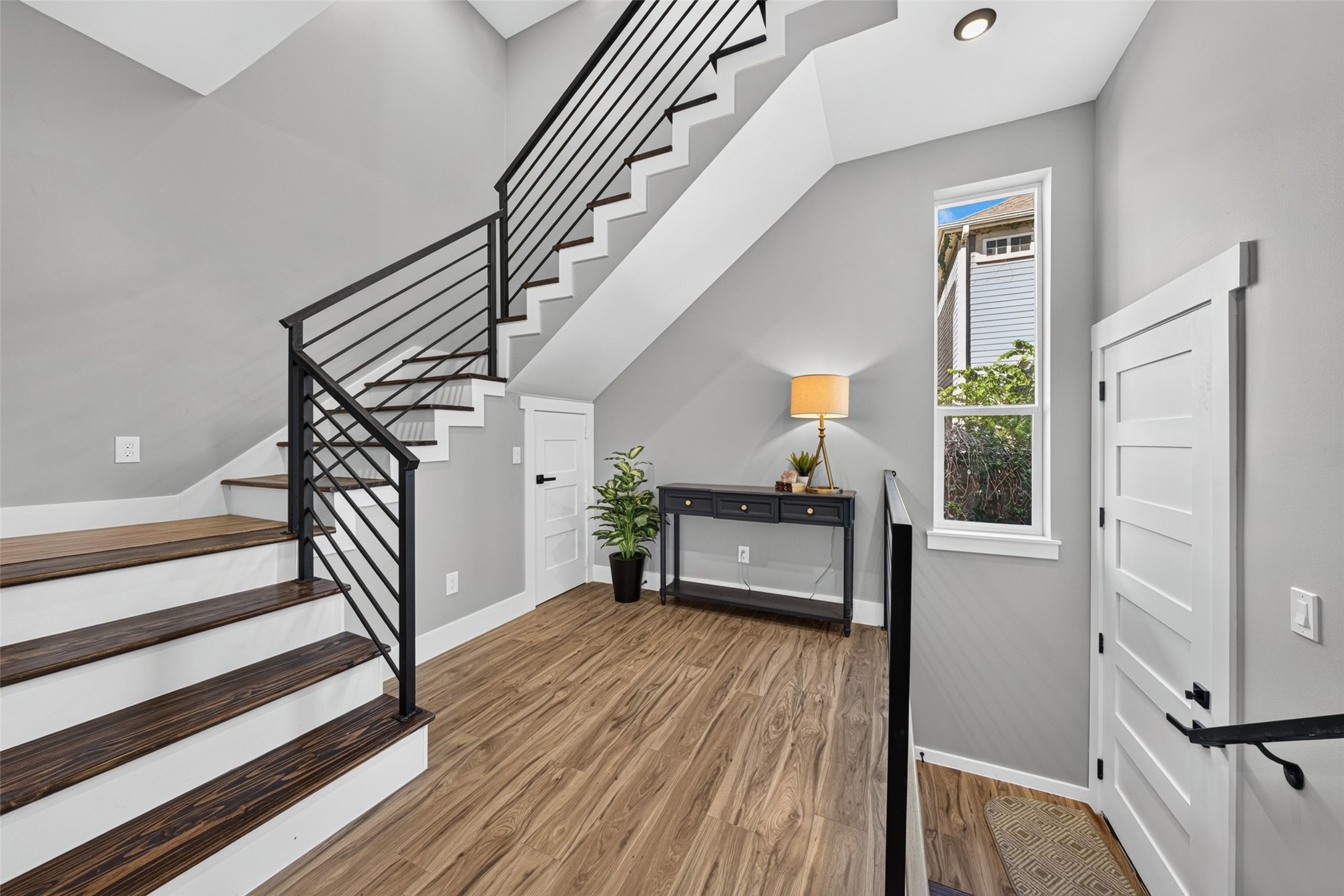 Cozy home office nook neatly tucked beneath the stairs, creating a perfect dedicated study area.