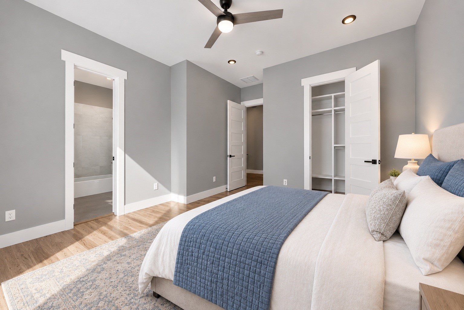 Cozy first-floor bedroom perfect for guests with large walk-in closet. (virtual staged)