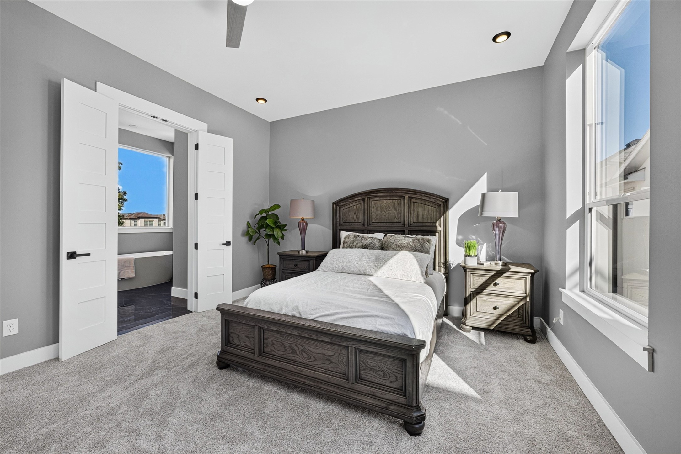 Wide windows flood the room with natural light, offering bright views and an airy atmosphere.