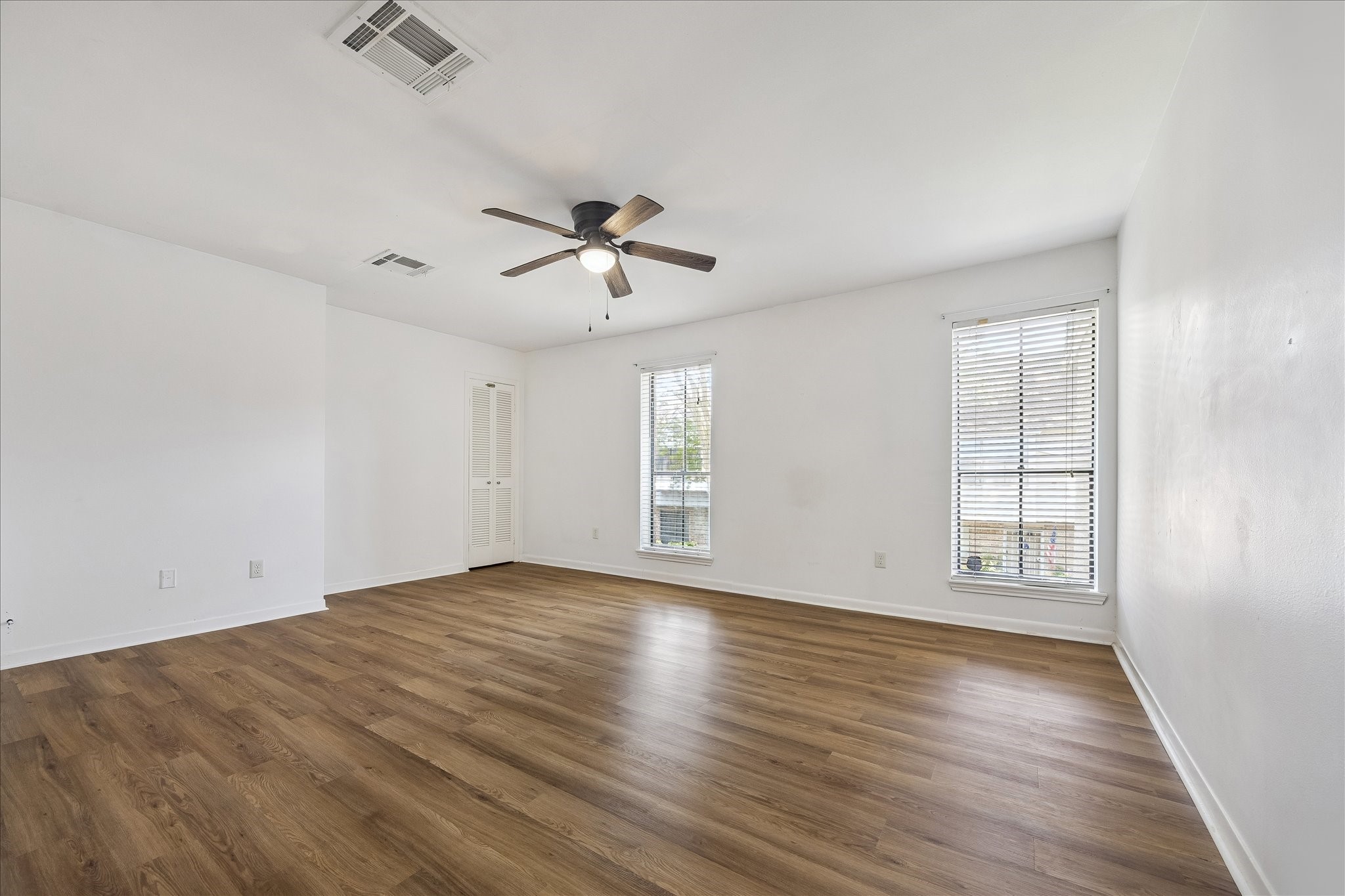 Retreat to the No carpet primary bedroom on the second floor