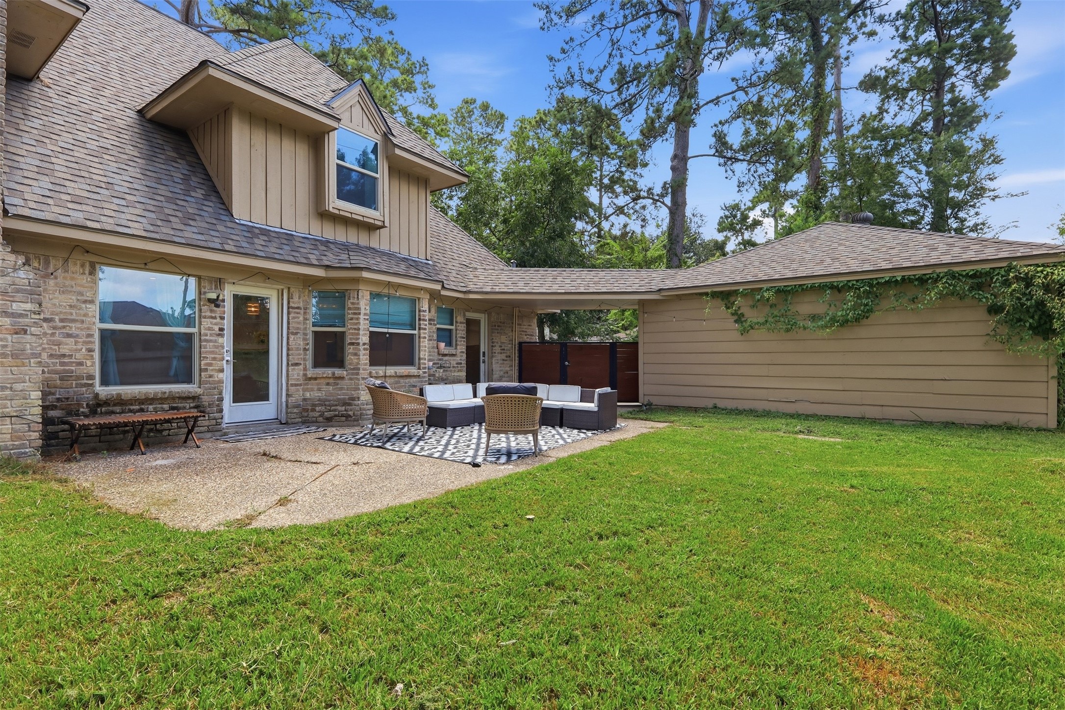 Spacious backyard with a patio area and plenty of room to relax, entertain, or play.