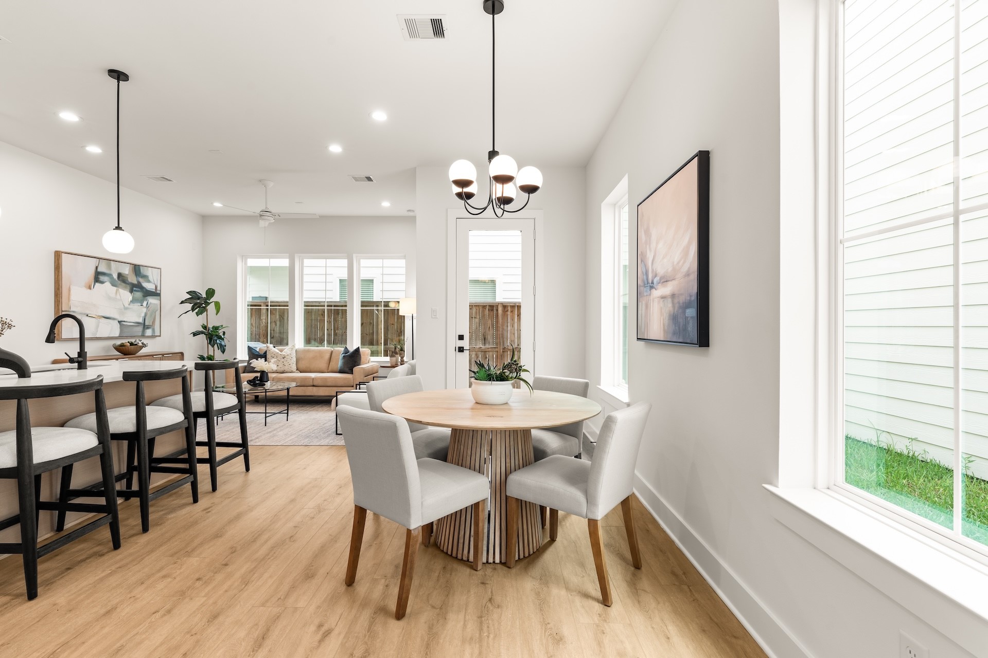 Sunlit dining nook seamlessly open to the kitchen for casual everyday meals