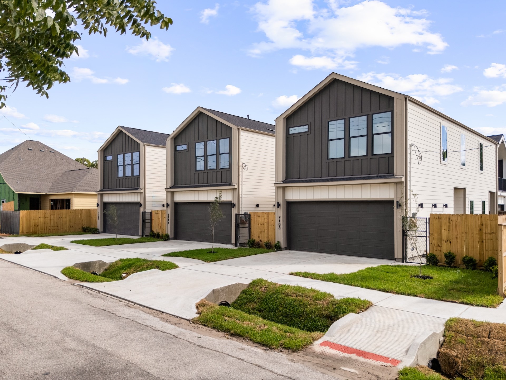 Contemporary architectural style paired with clean exterior lines and private garage parking.