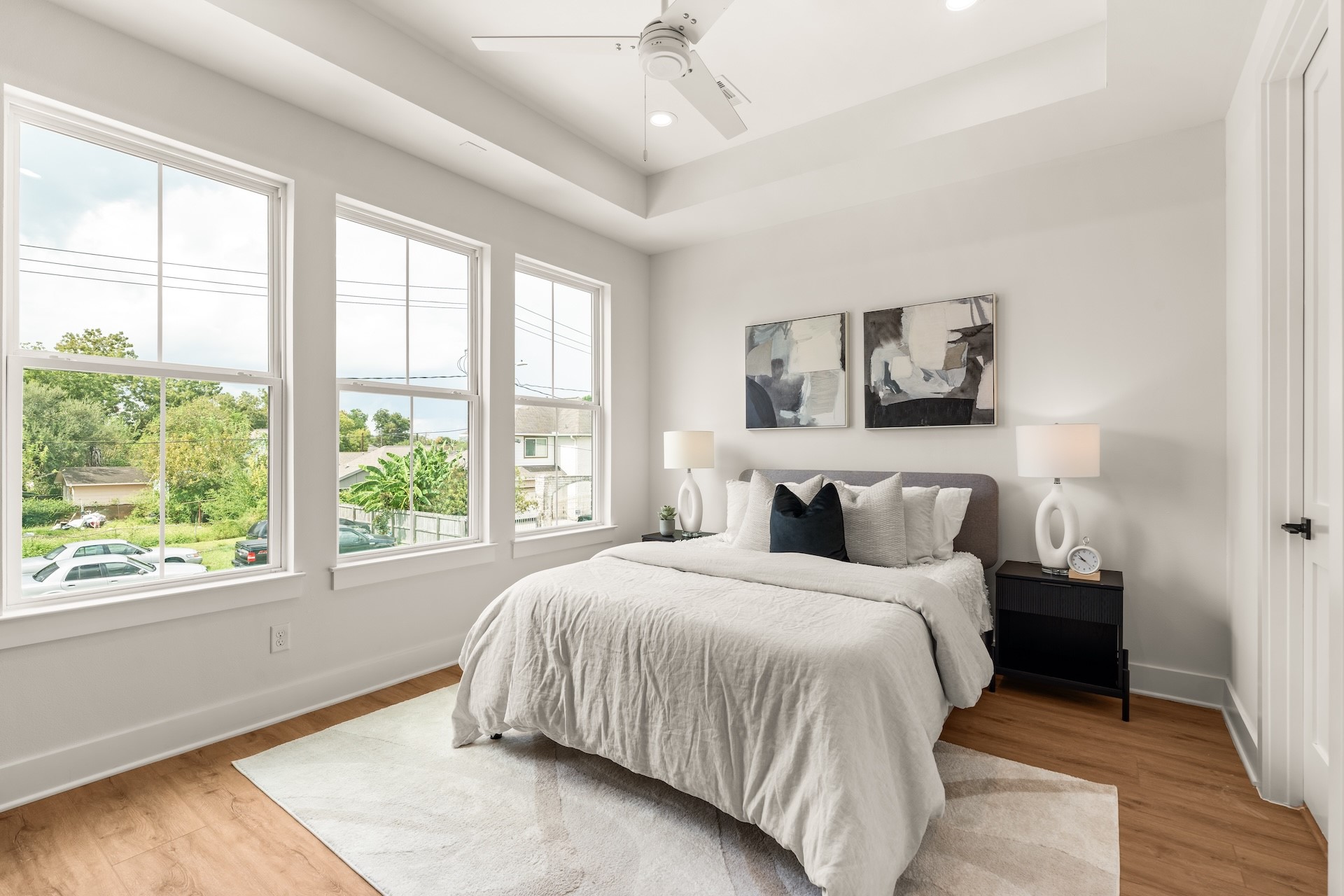 Serene primary bedroom designed with ample space for king-sized furniture and lounge decor.
