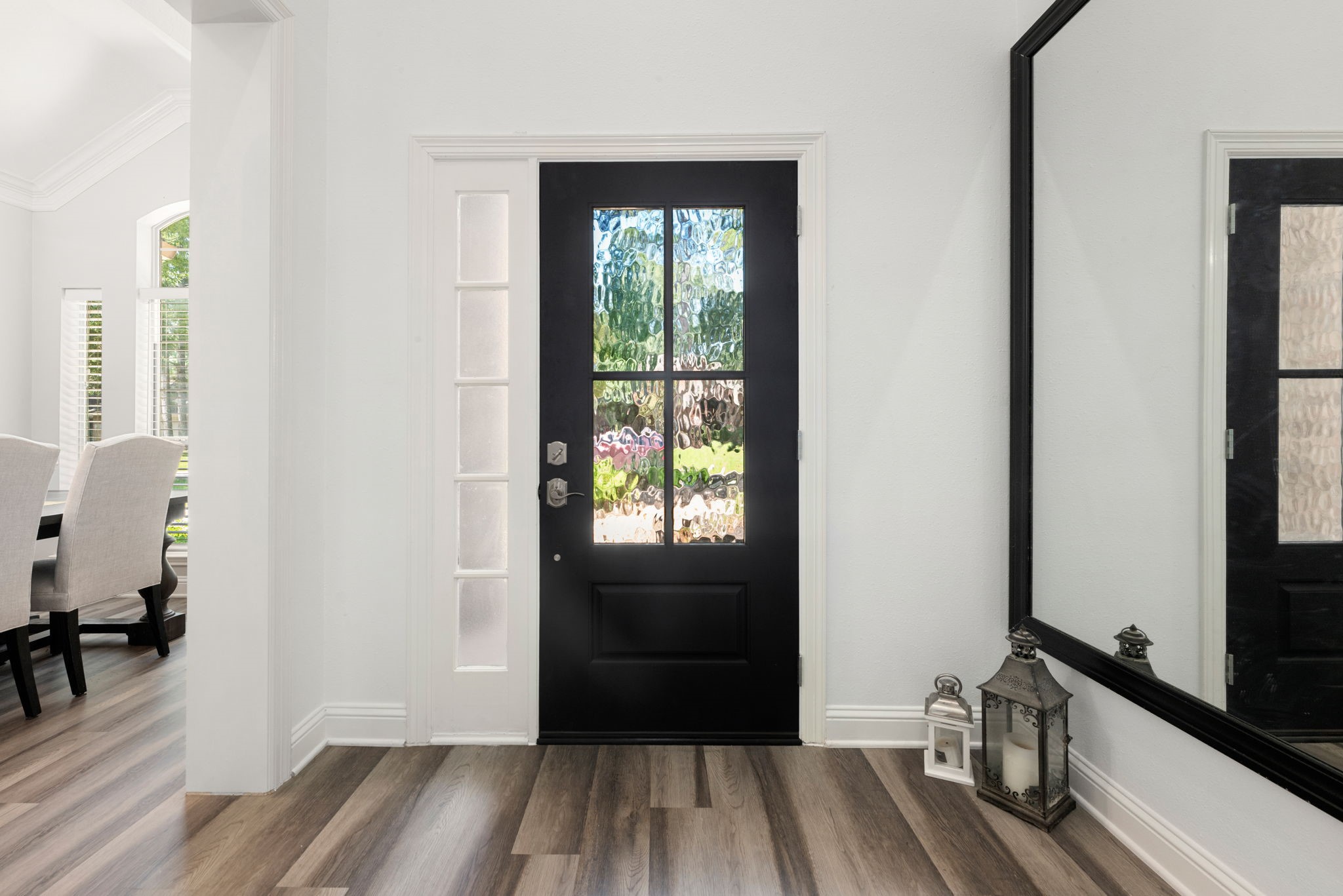 Elegant entryway with a contemporary style font door.