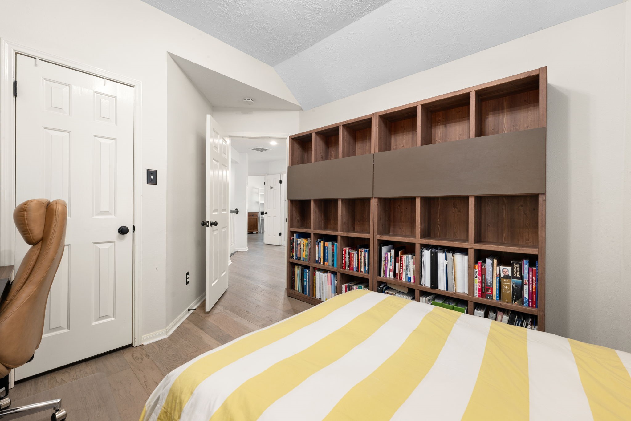 A cozy secondary bedroom is perfect for home office.