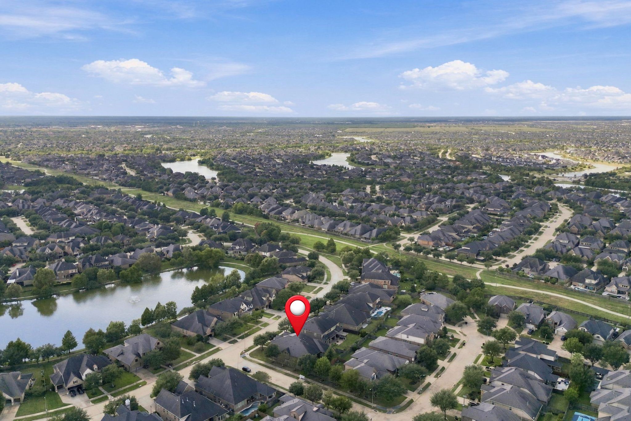This additional aerial view pinpoints the home's location within Cross Creek Ranch, highlighting its convenient setting near neighborhood lakes, walking trails, schools, and shopping.