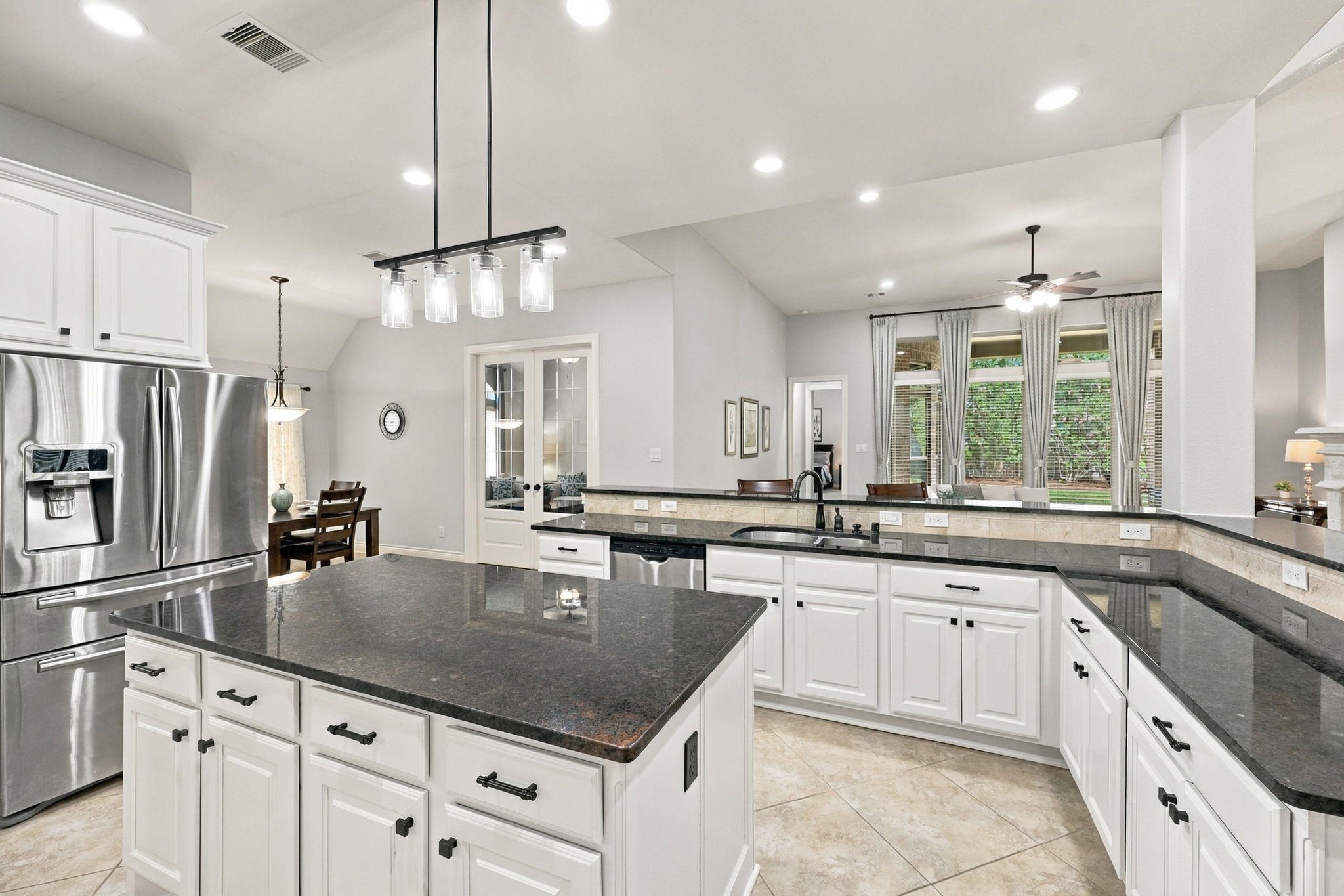 Additional Kitchen highlights include a stainless steel undermount sink paired with an elegant oil-rubbed bronze gooseneck faucet. An added bonus for the new homeowner, the Samsung kitchen refrigerator will remain with the home!