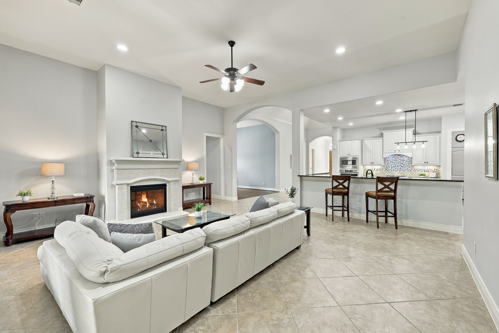This view from the opposite side of the Family Room highlights the spacious depth of the room and the easy, open flow into the Kitchen, creating an ideal layout for everyday living and entertaining.