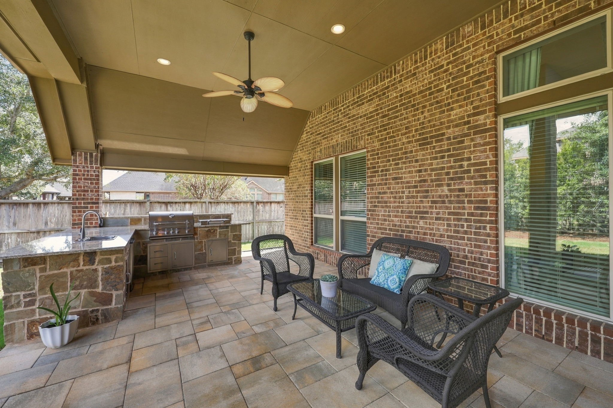 The Covered Patio is also equipped with two 5-blade ceiling fans for added comfort and LED ceiling lights, making this outdoor living space enjoyable both day and night.