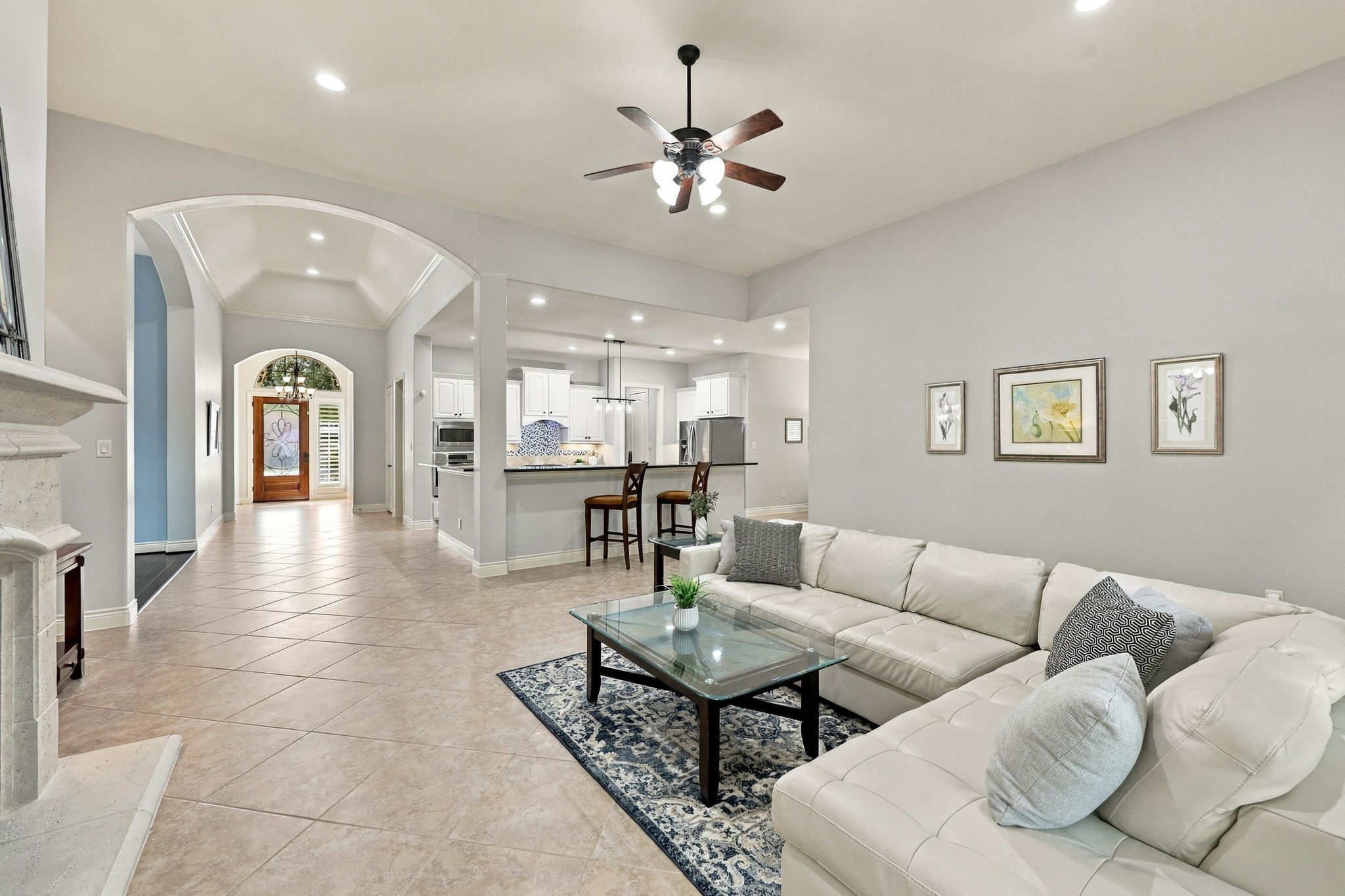 This view from a different angle looks back toward the front Foyer and Kitchen, highlighting the home's open layout and the seamless flow between the main living spaces.