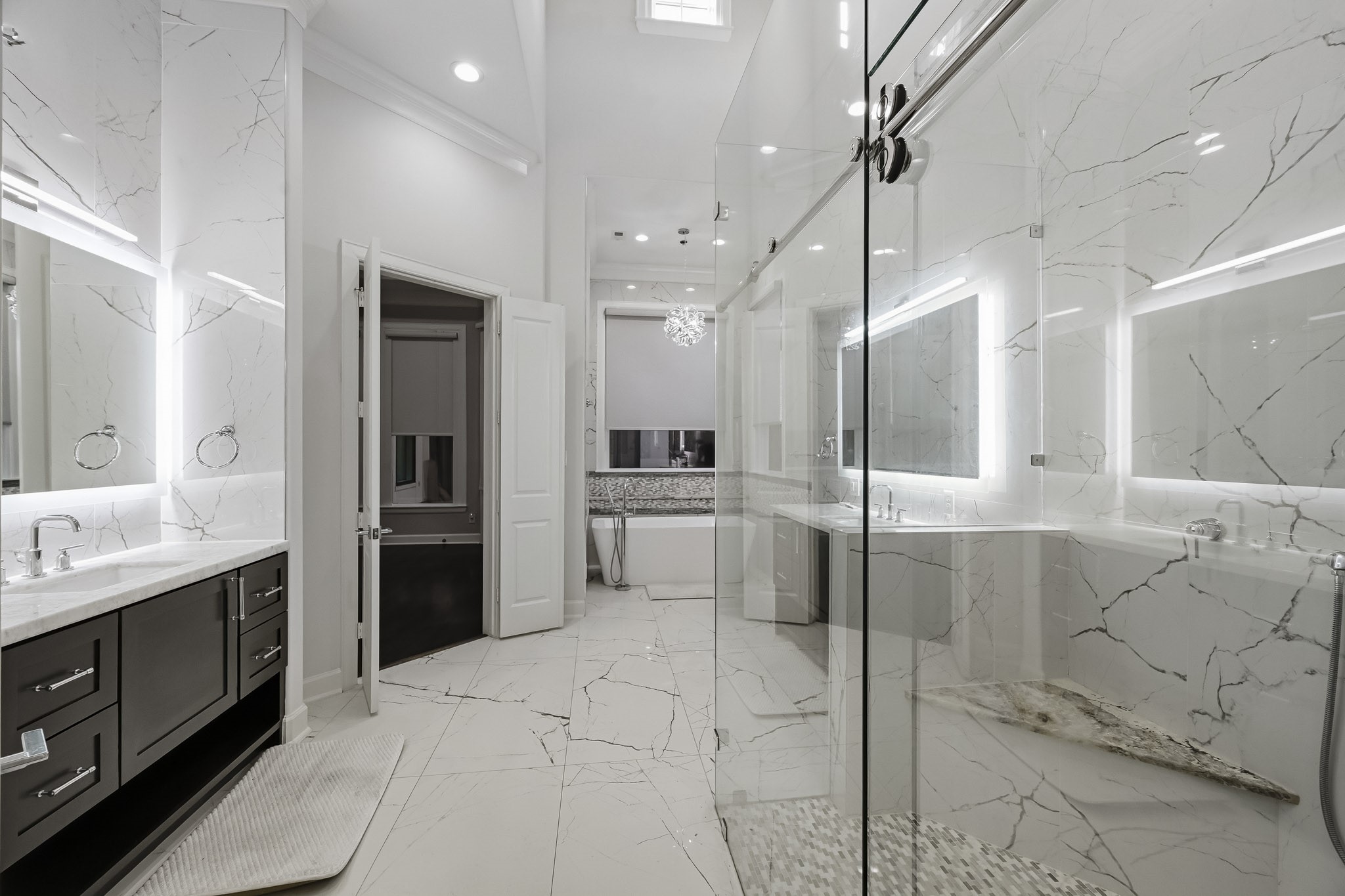 Primary bathroom leads into the huge walk in closet.