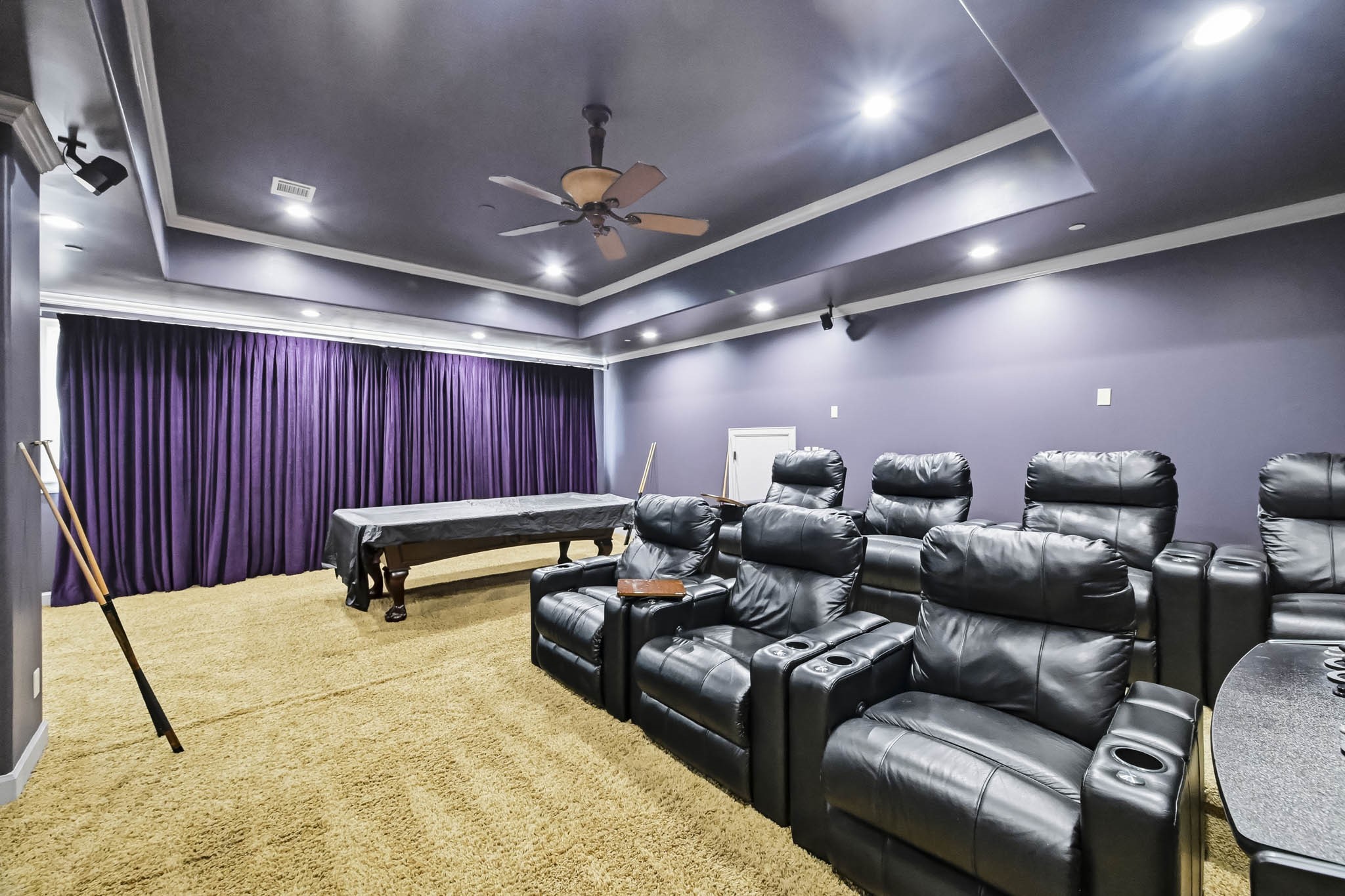 Luxurious home theater with ambient lighting.