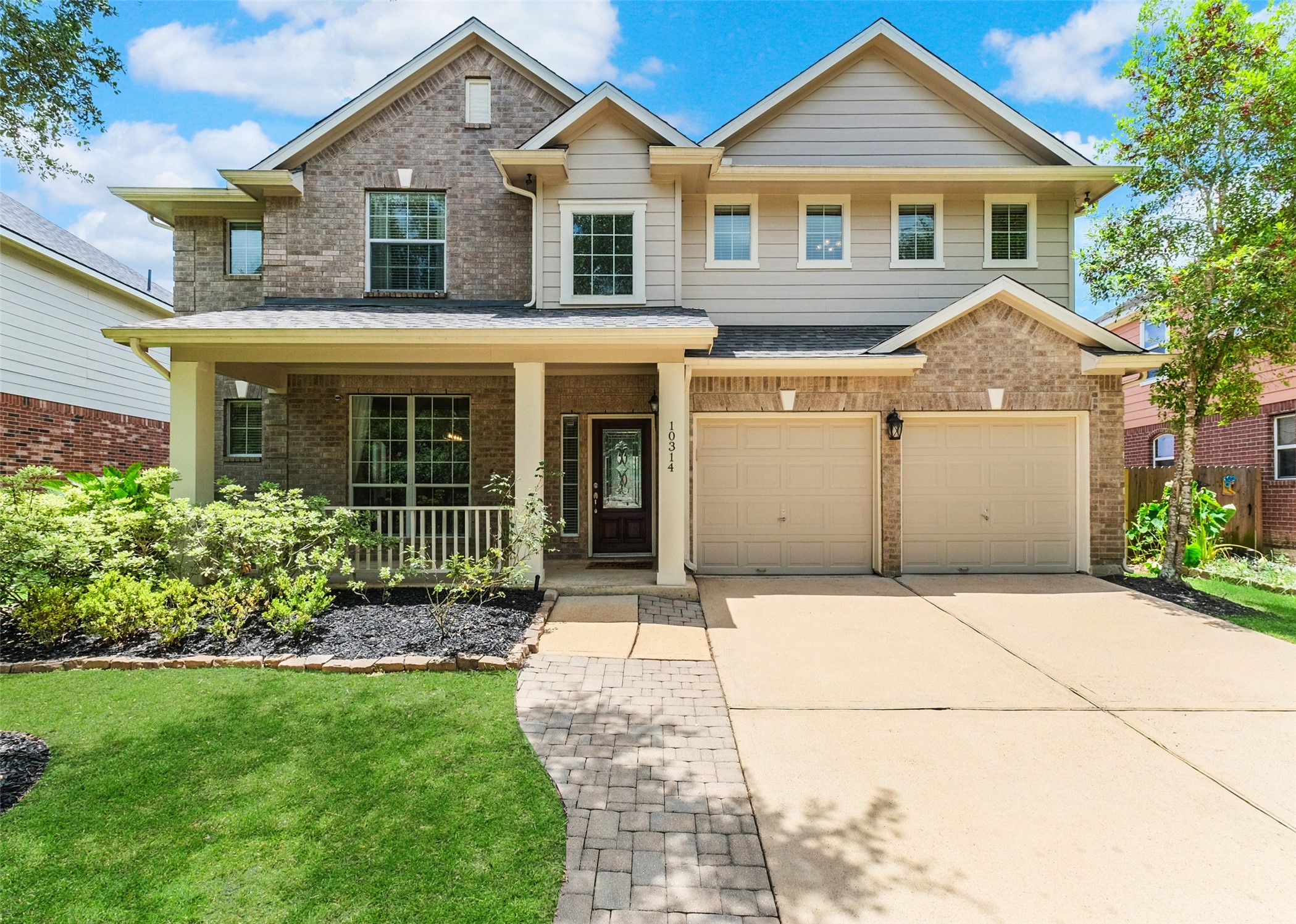 This inviting two-story home features a charming brick and siding exterior, a welcoming covered porch, and a spacious two-car garage. Lush landscaping enhances its curb appeal, making it an ideal choice for a family. This inviting two-story home features a charming brick and siding exterior, a welcoming covered porch, and a spacious two-car garage. Lush landscaping enhances its curb appeal, making it an ideal choice for a family.