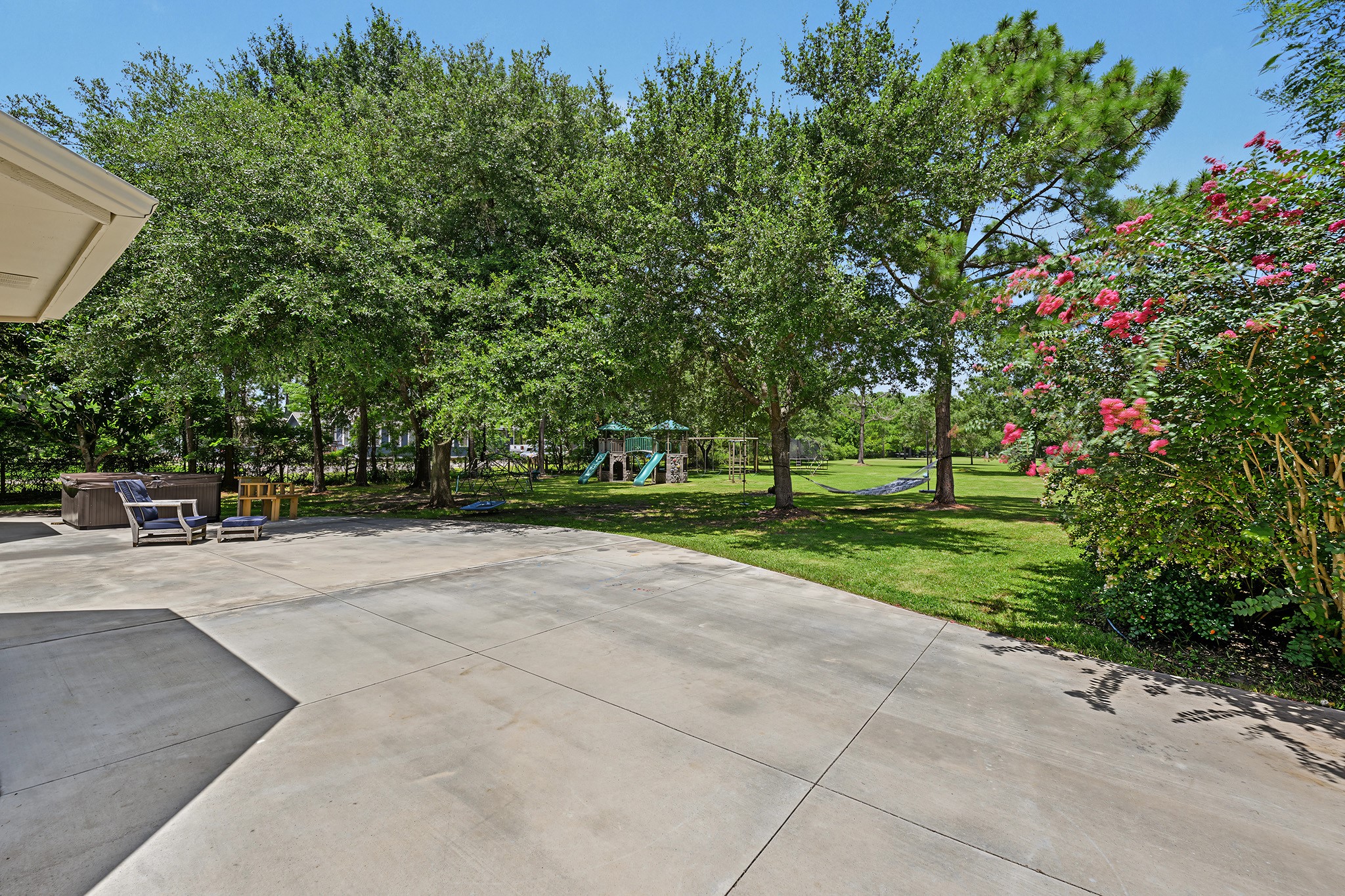 Back patio with serene views of the large lot