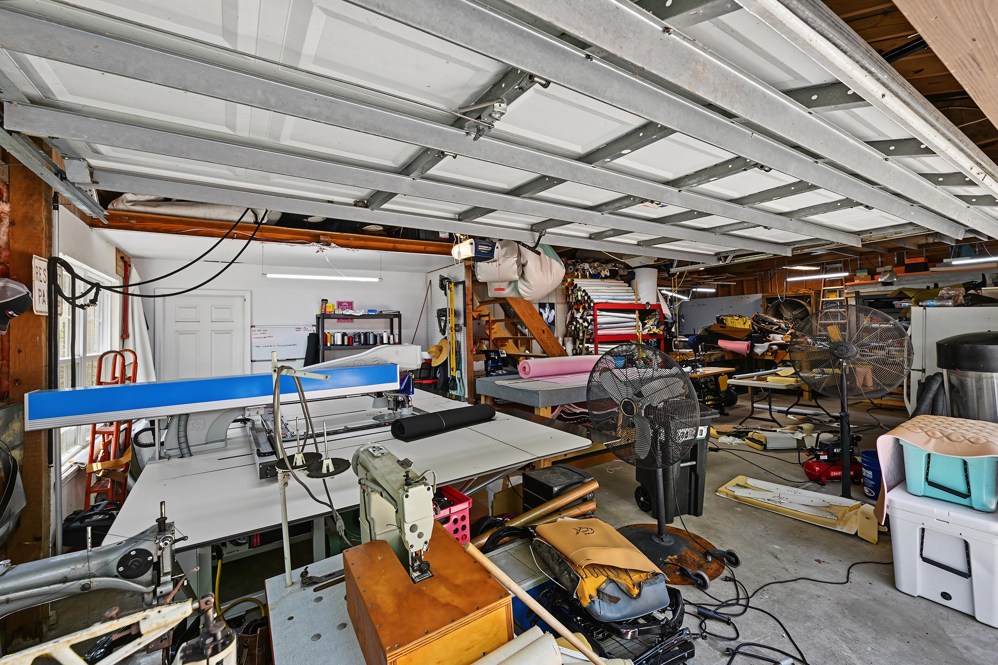 Large garage that can fit several vehicles along with storage.