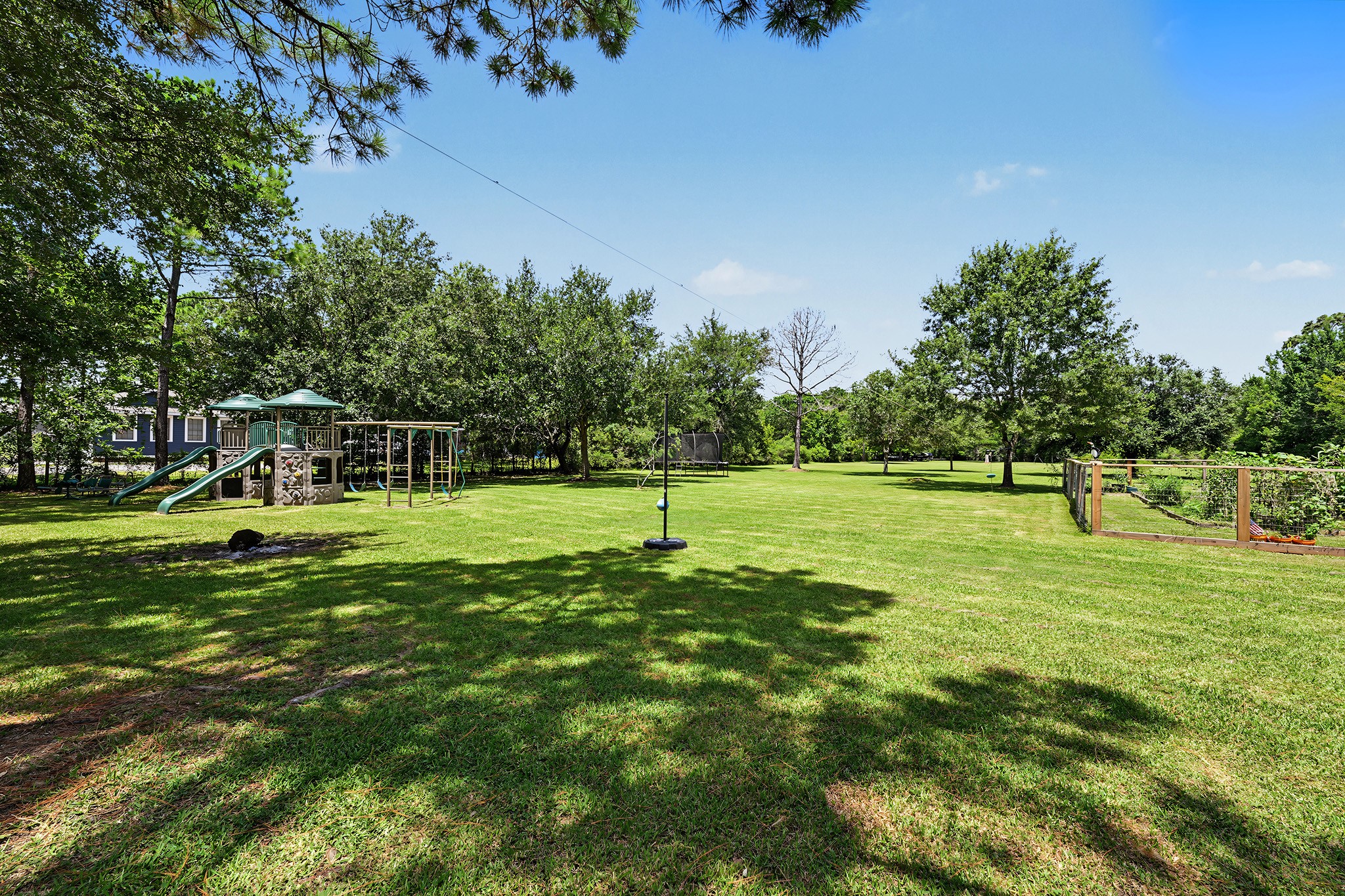 The property offers an installed commercial grade play structure and fenced garden!