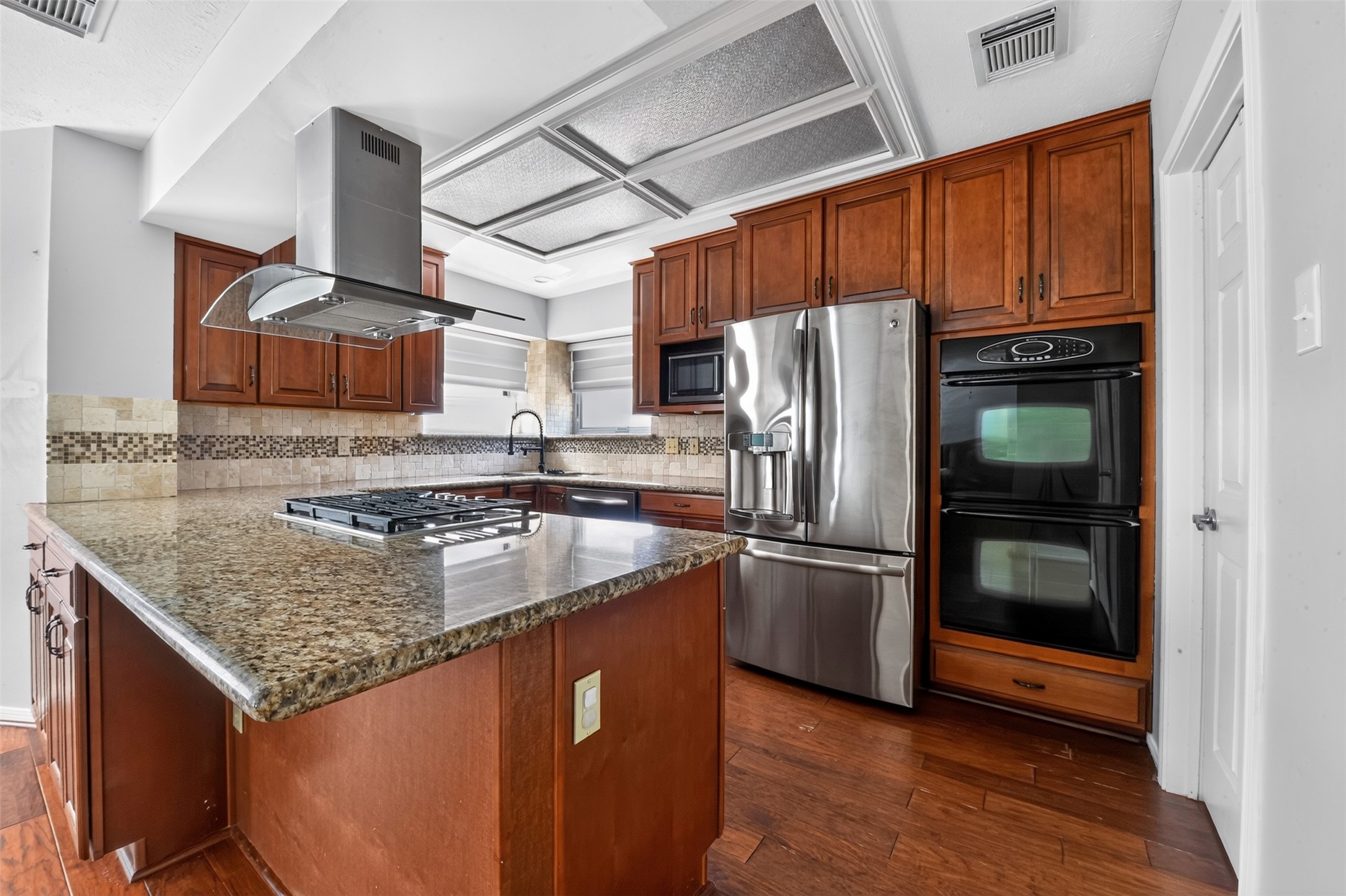 Kitchen has double ovens plus a built in microwave.