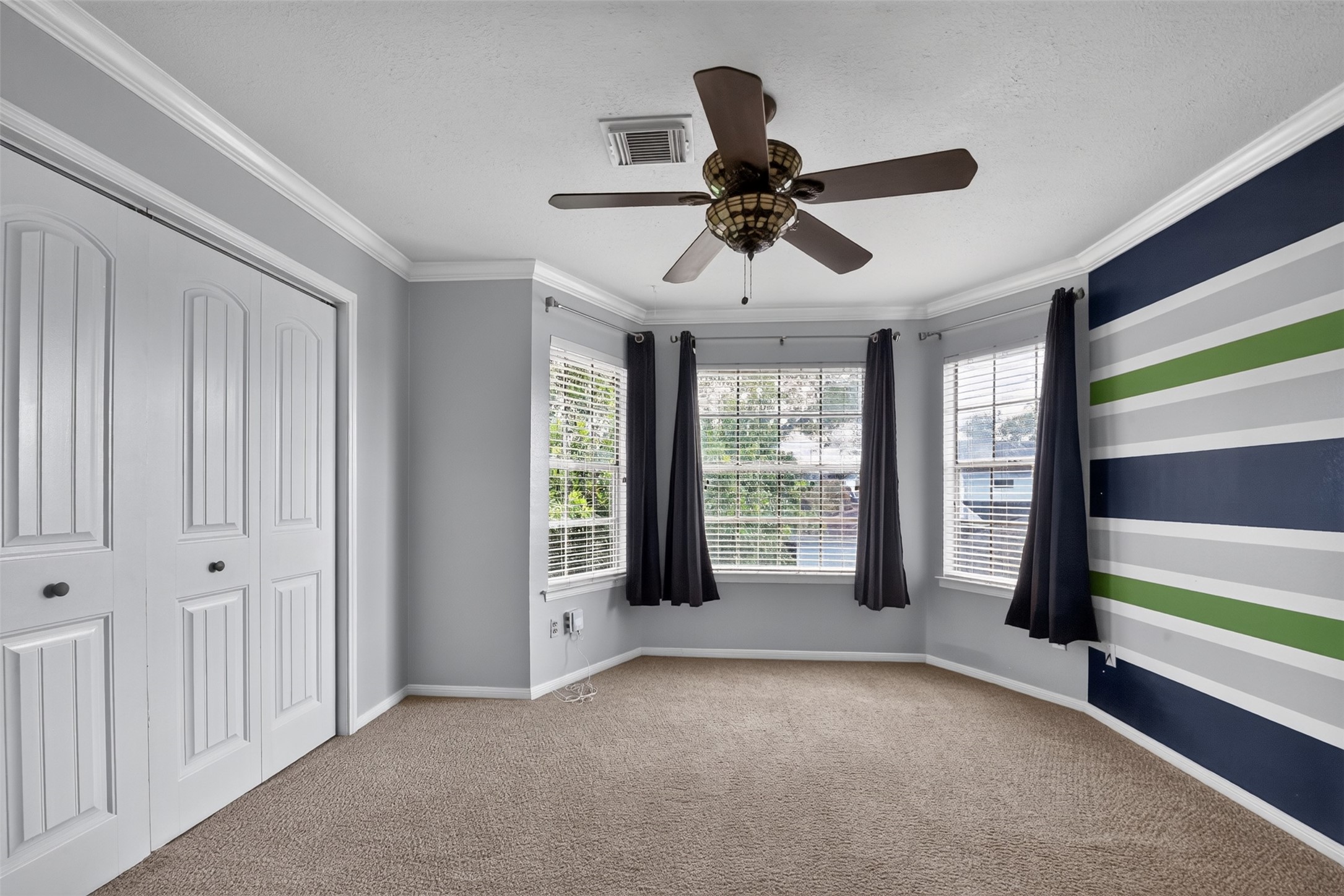 At the top of the stairs, is your flex room.  Use it as a spacious bedroom or as a game room.