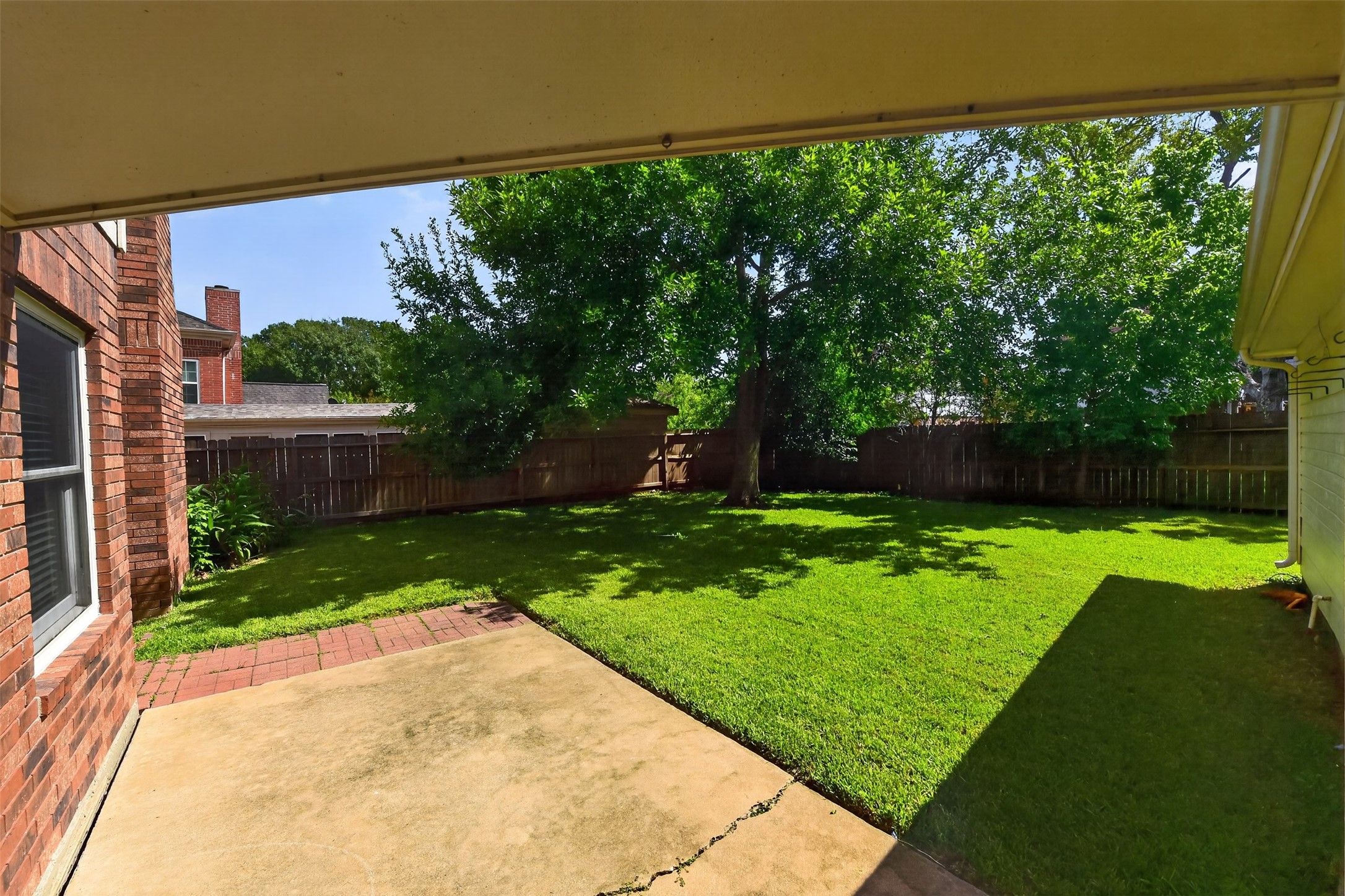 Covered walkway from the garage to the house protects you from the elements as you unload your car.