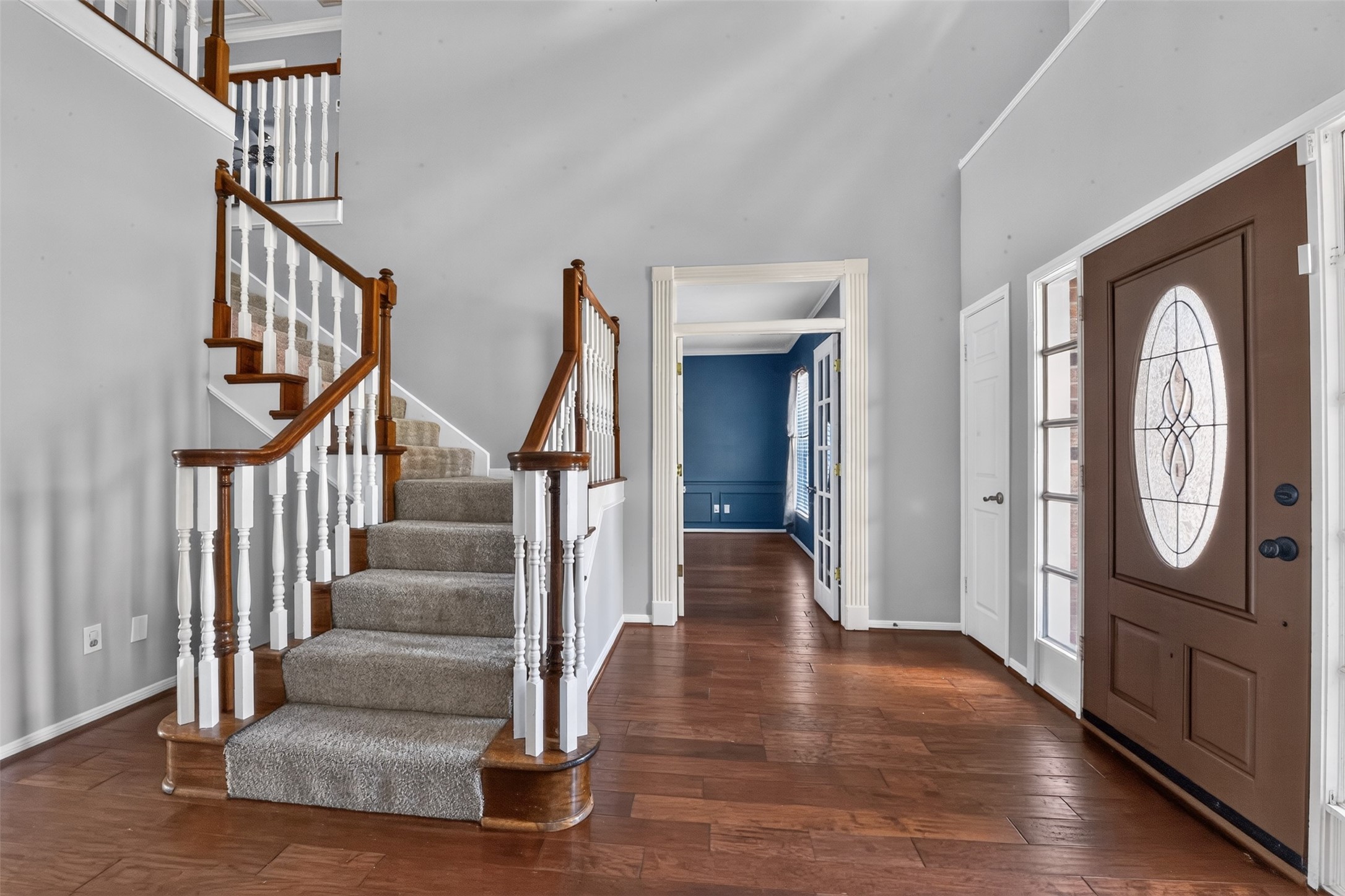 Welcome!  Inviting entry has high ceilings and wood floors.