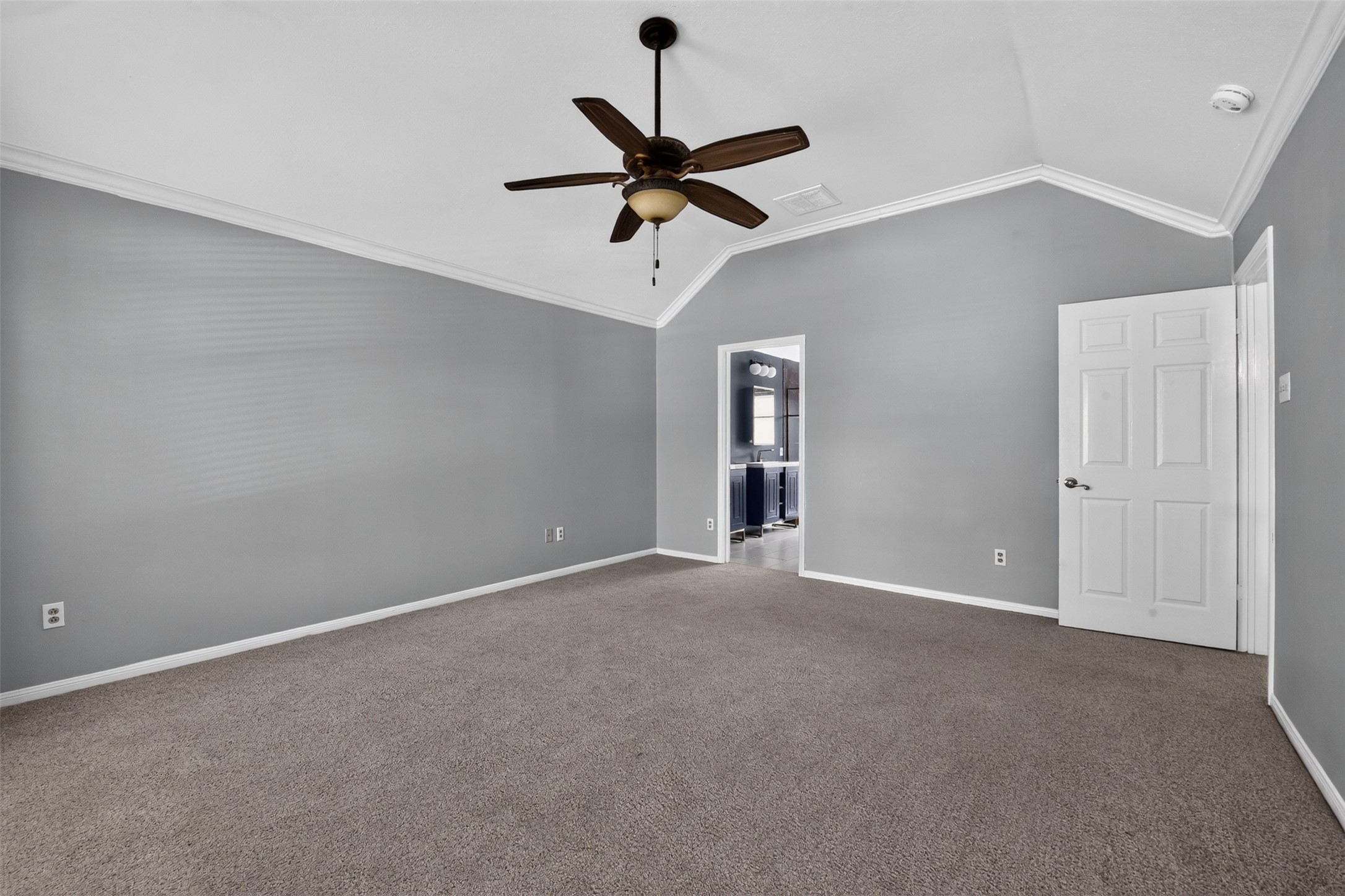 Crown molding and a high ceiling add character to the suite.