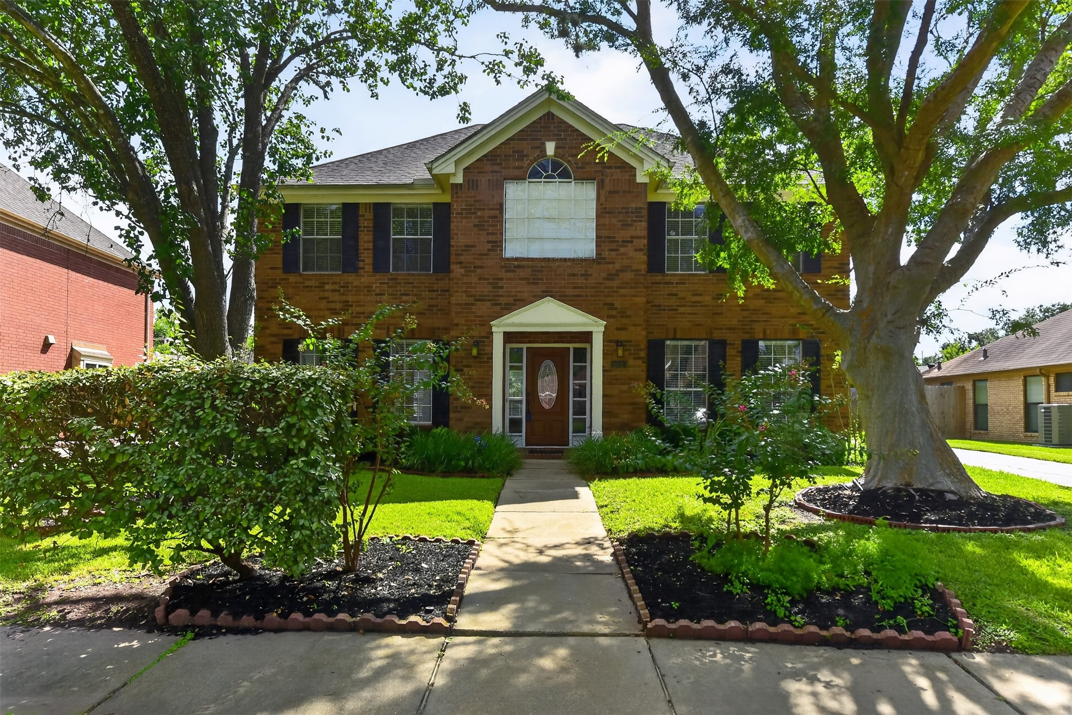Your new home greets you with stately trees and lush landscaping. Your new home greets you with stately trees and lush landscaping.