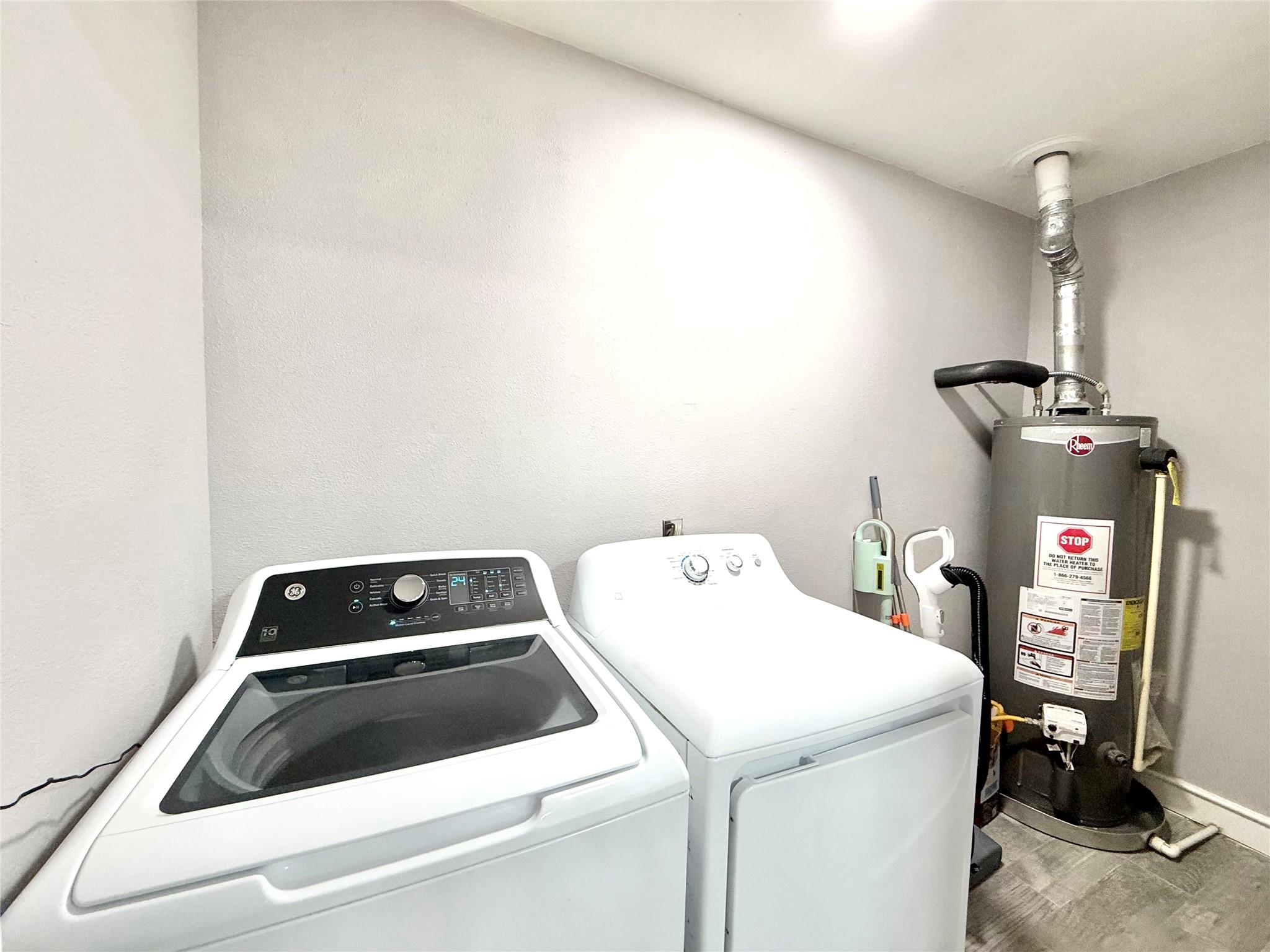 Utility room is conveniently located just off of the kitchen and is oversized