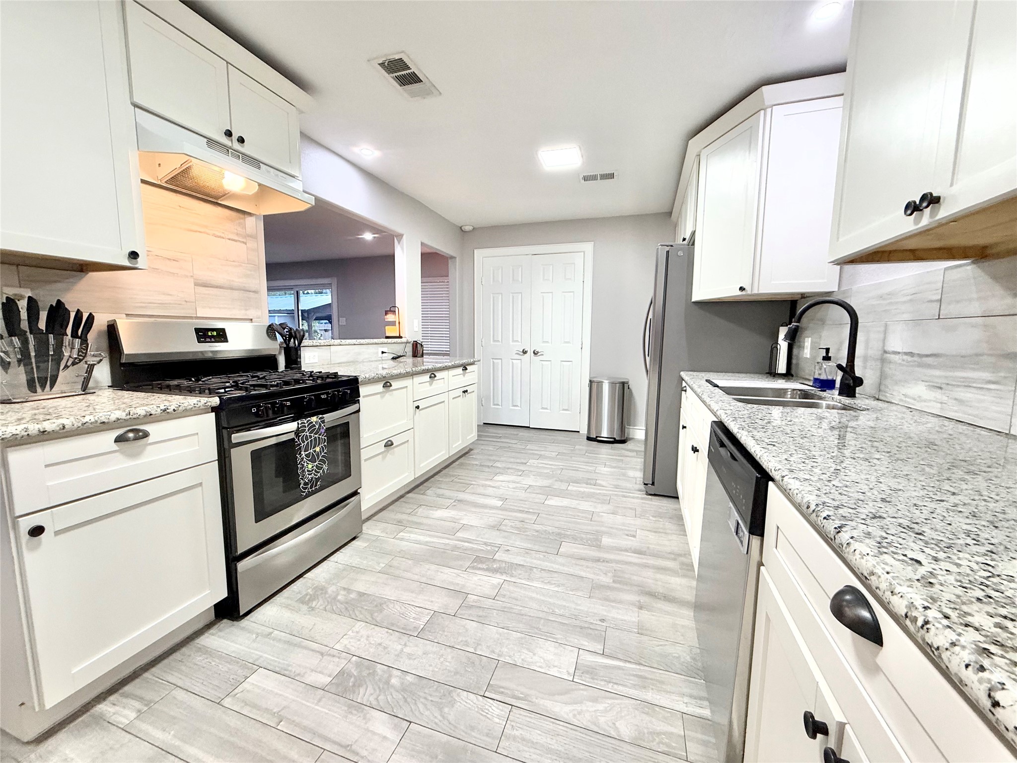 Gourmet Kitchen with so much storage! Granite counters, soft closing drawers