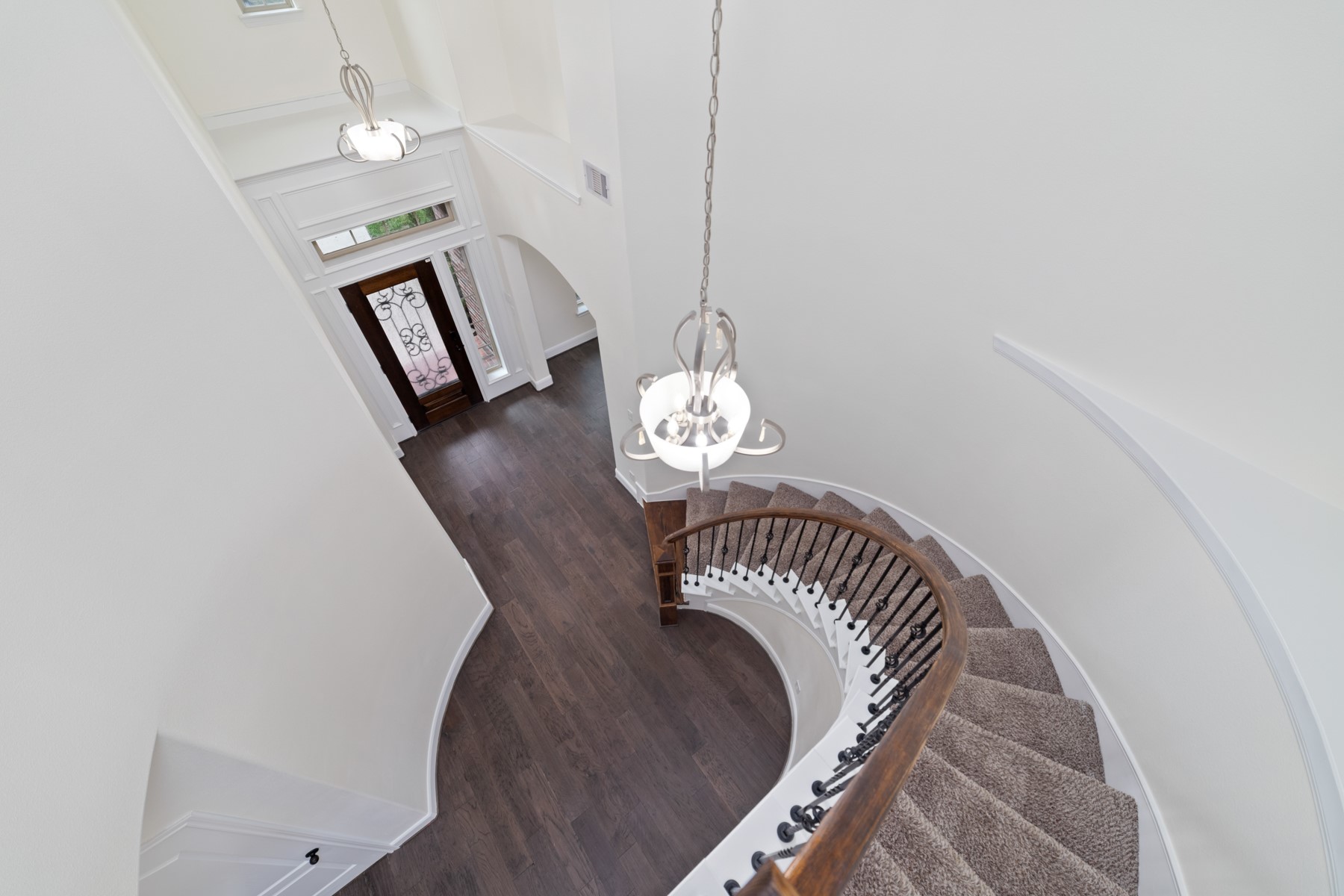 This home features a stunning curved staircase that adds elegance and creates a striking architectural focal point.