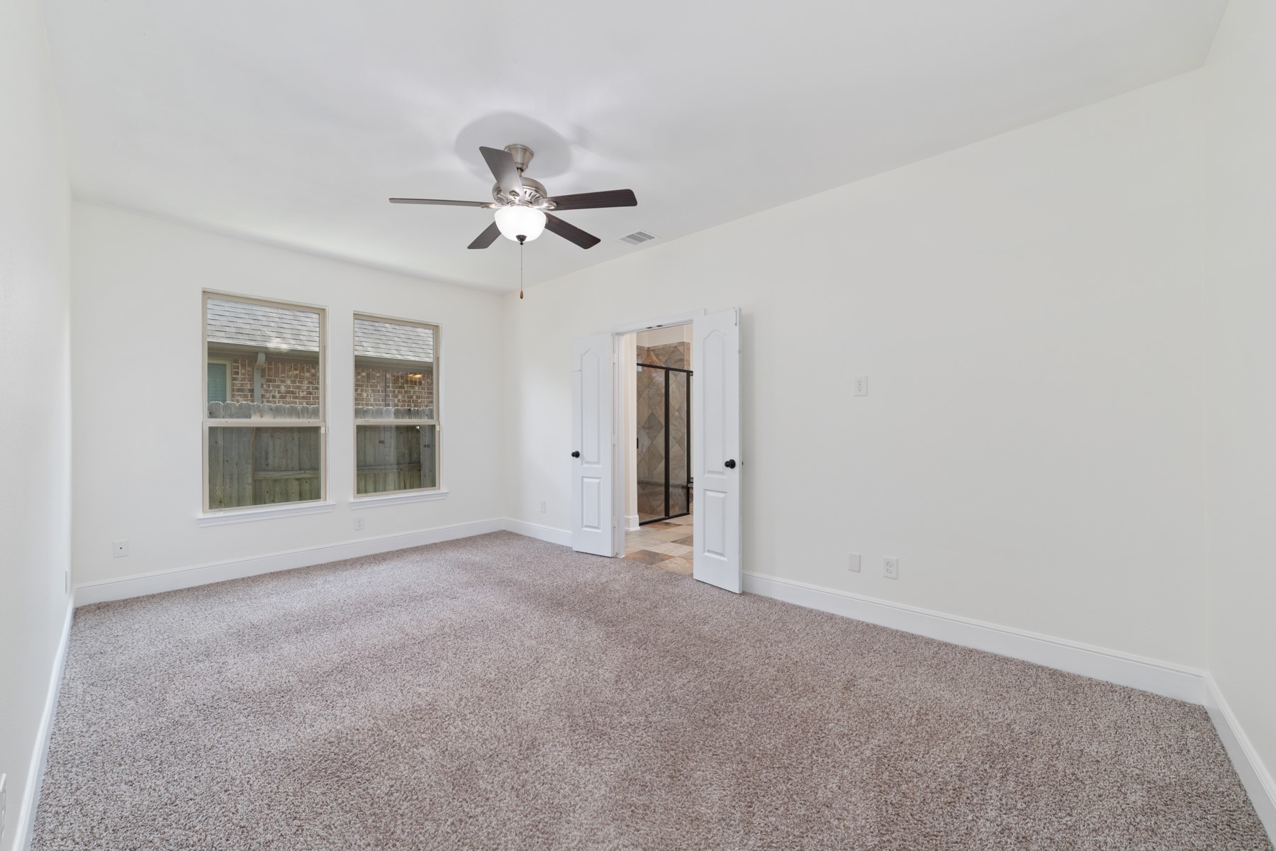 Second primary bedroom in the house on the first floor.