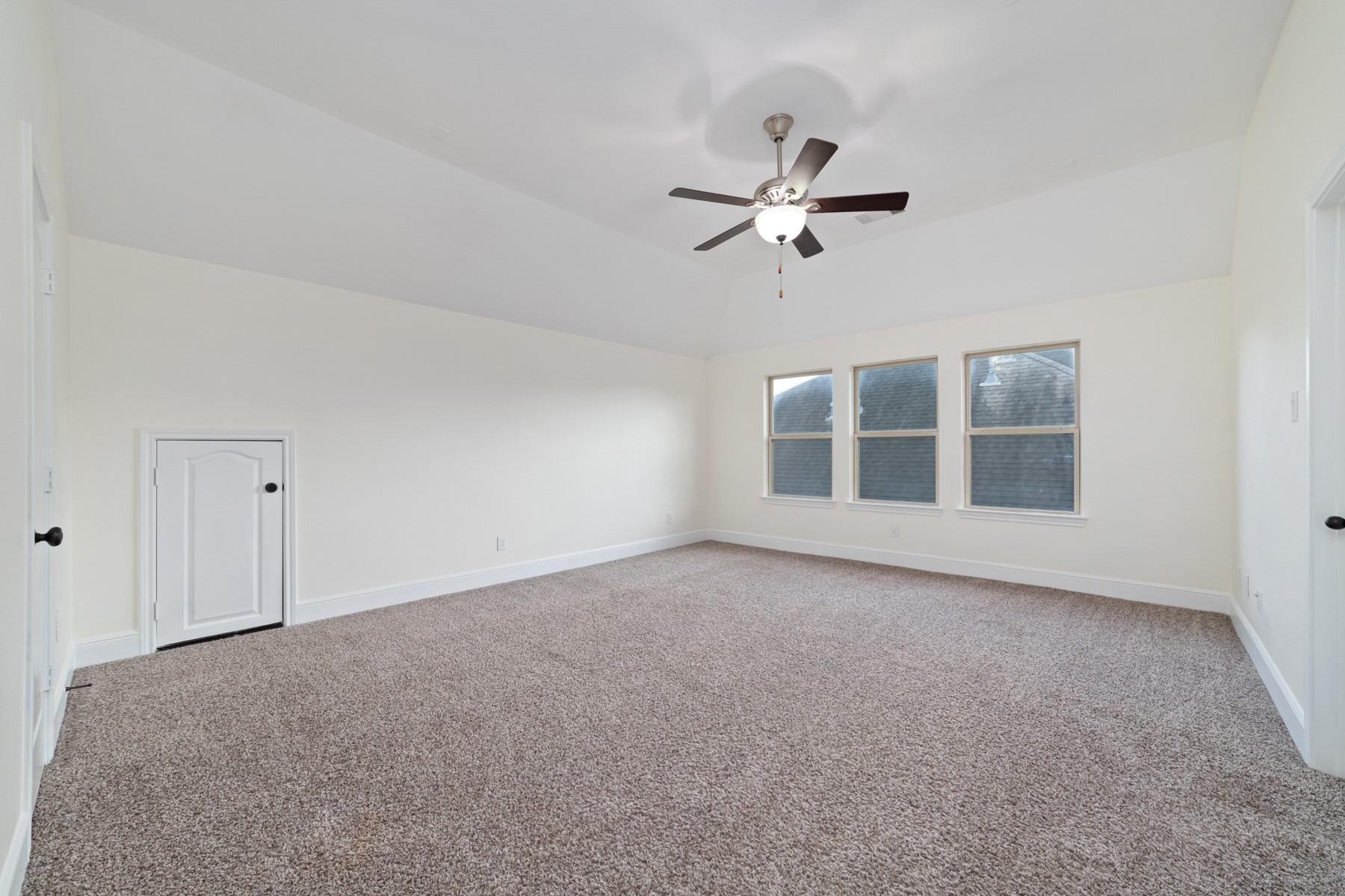 Upstairs, the spacious game room provides the perfect place for family gatherings, game nights, or simply relaxing together