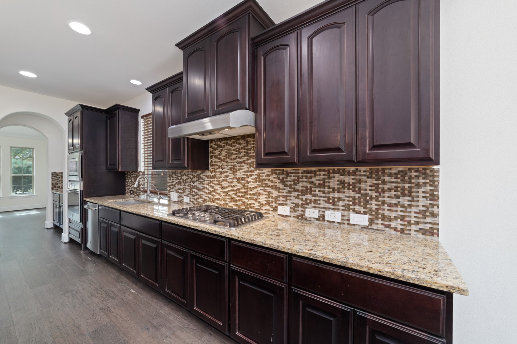 The kitchen has plenty of storage space and open to the living room.