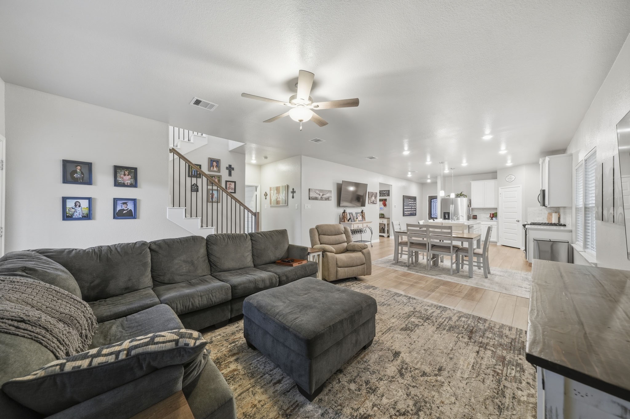 Open-concept living area to the modern dining space and a sleek kitchen, perfect for entertaining and family gatherings.