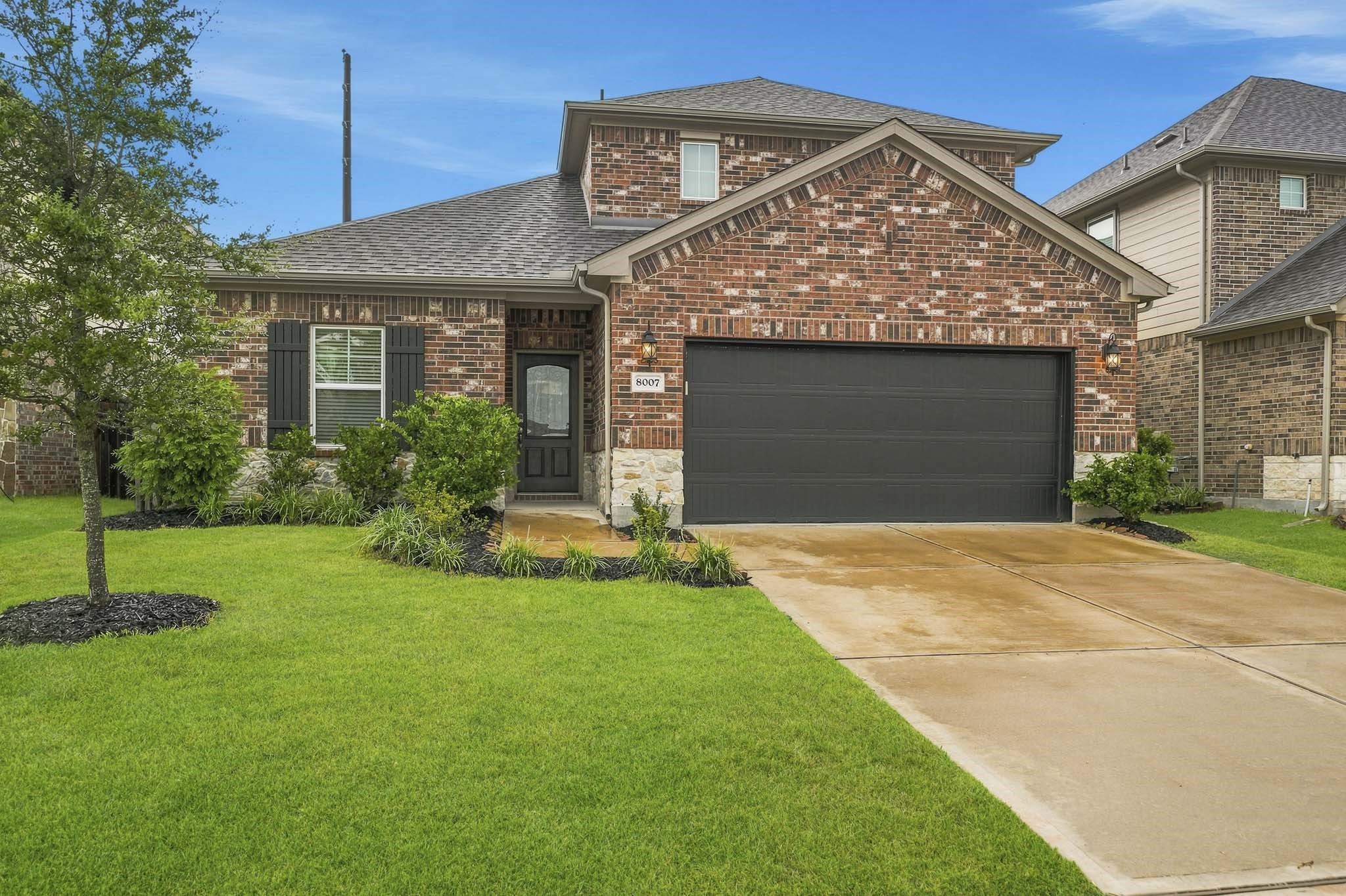 Charming brick home with a well-maintained lawn and a spacious two-car garage, offering great curb appeal in Bellfort Farms Charming brick home with a well-maintained lawn and a spacious two-car garage, offering great curb appeal in Bellfort Farms