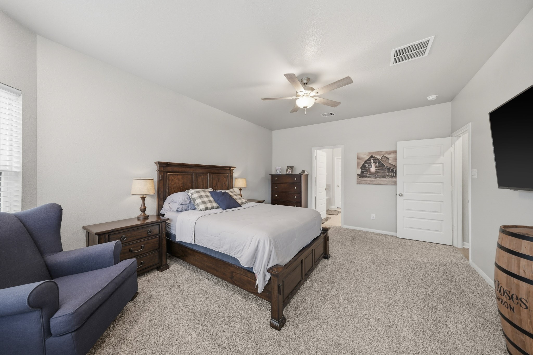 Spacious bedroom with carpet flooring,