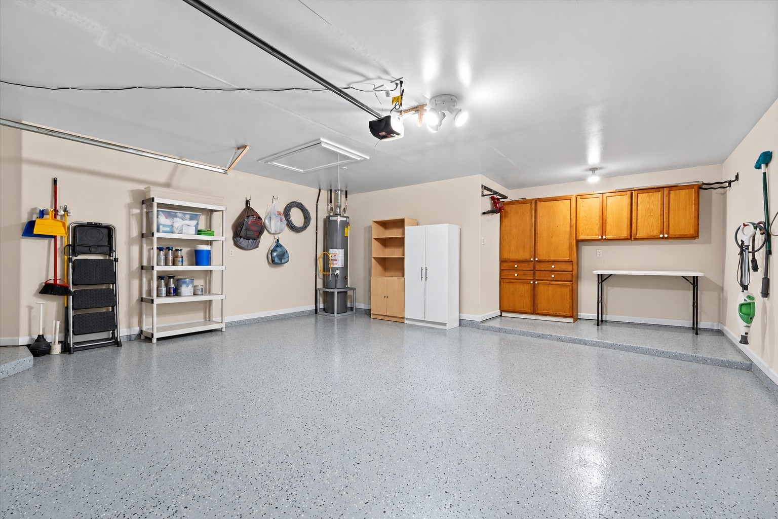 Epoxy coated garage floor. Built-in cabinets Epoxy coated garage floor. Built-in cabinets