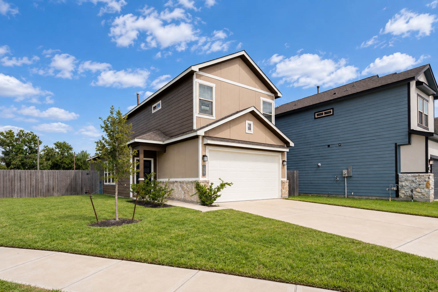 Welcome to 1007 Santee Ct, a brand-new two-story home in the Glendale Lakes community. Warm tan siding, stone accents and a crisp white two-car garage door give it fresh curb appeal, while the young tree and clean green lawn leave room for the new owner to make the yard their own. A wide driveway means easy parking for the family and guests the moment you pull up and step out.