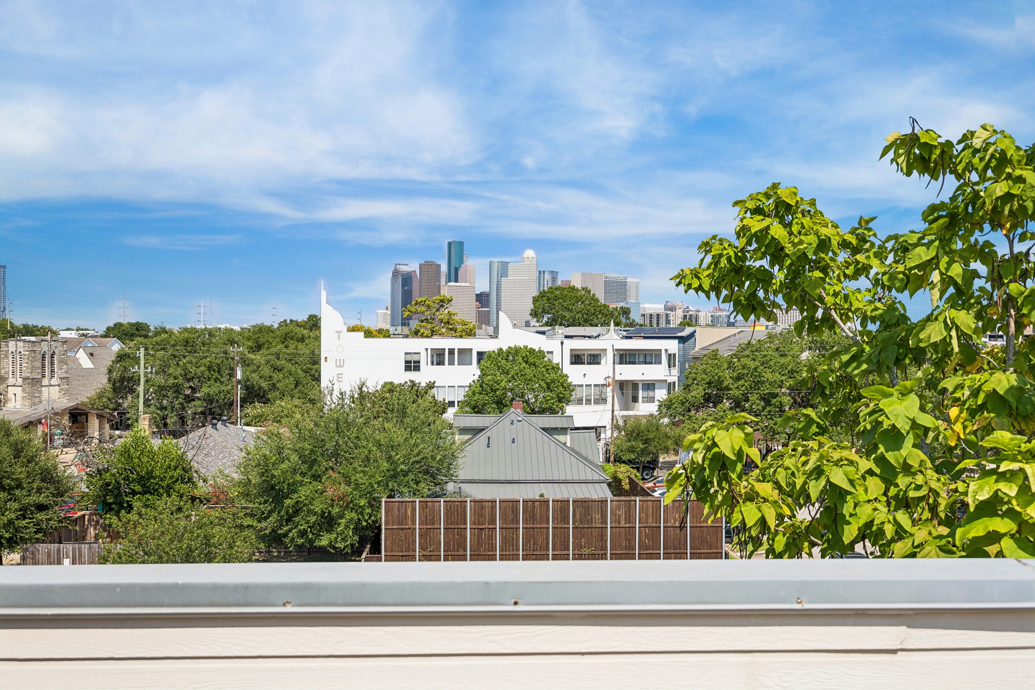 Downtown Houston skyline views from the rooftop terrace.
