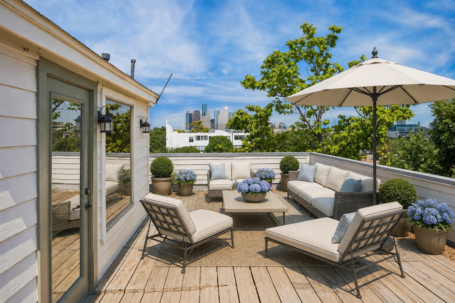 Expansive rooftop terrace with panoramic views of the city's skyline. Photo has been virtually staged.