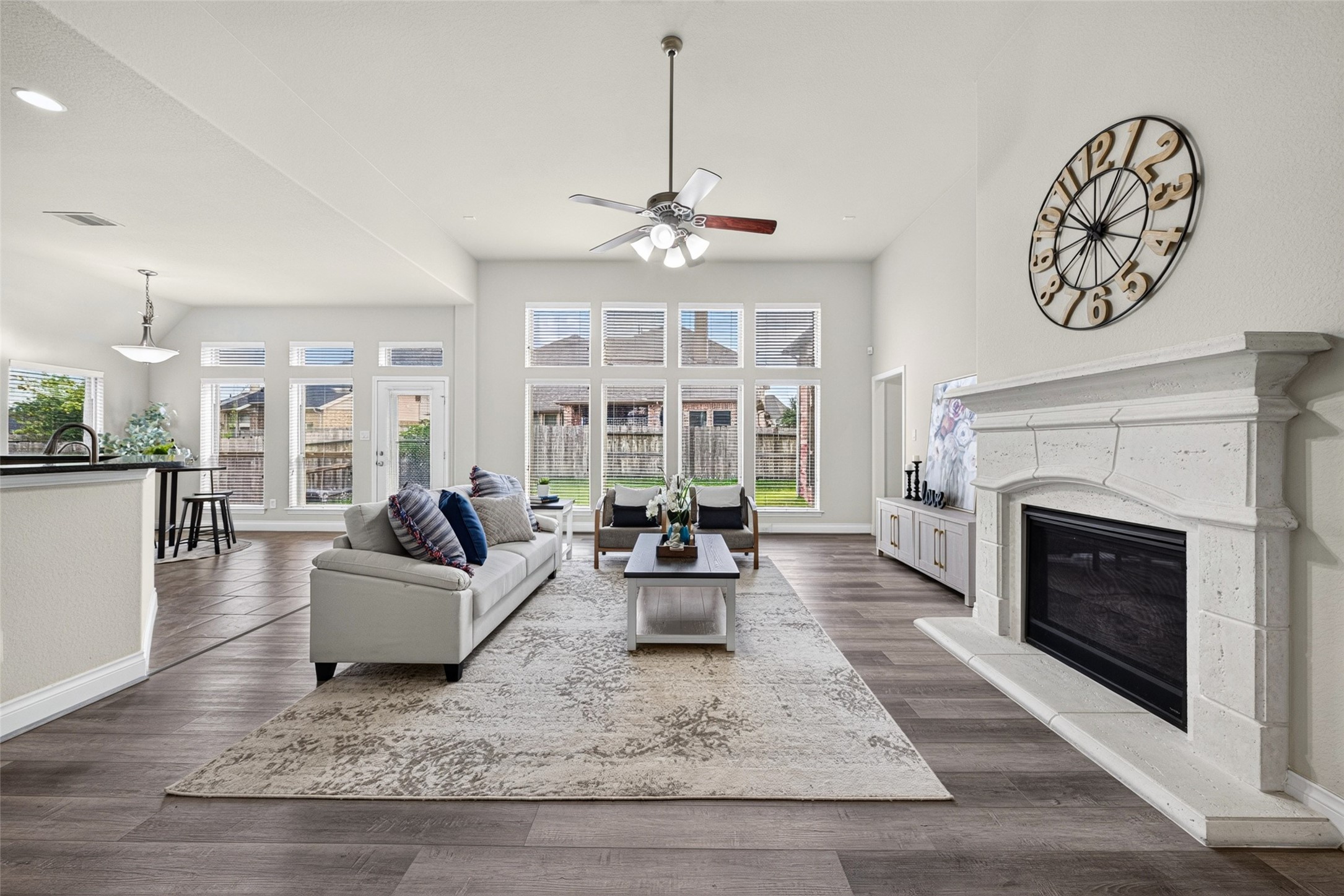 Open-concept main living area filled with natural light and finished with beautiful wood flooring. Open-concept main living area filled with natural light and finished with beautiful wood flooring.