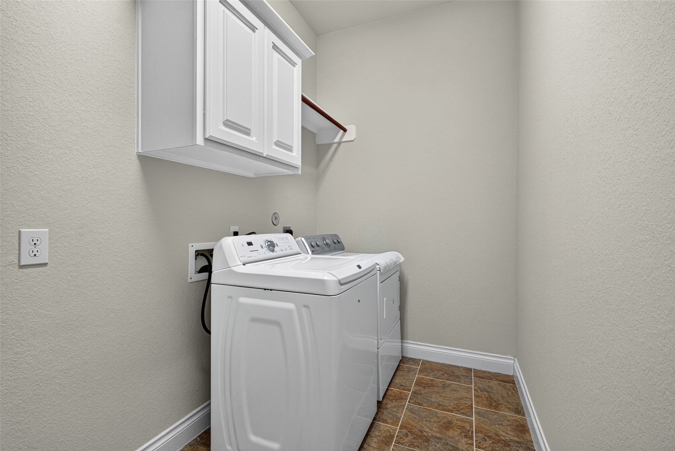 Functional laundry room with built-in storage to keep household chores easy and organized.