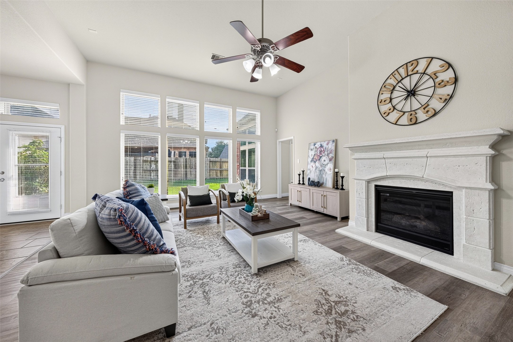 Cozy living room centered around a charming fireplace, perfect for warm family movie nights and chilly evenings.