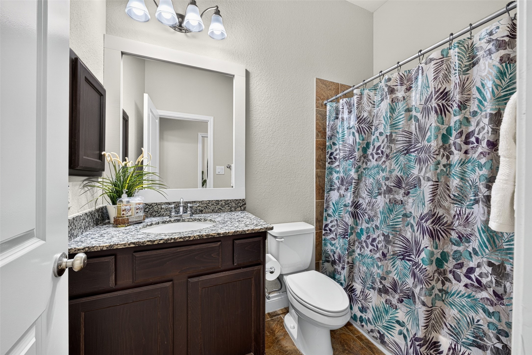 Secondary bathroom thoughtfully located to serve bedrooms and visiting guests with ease.